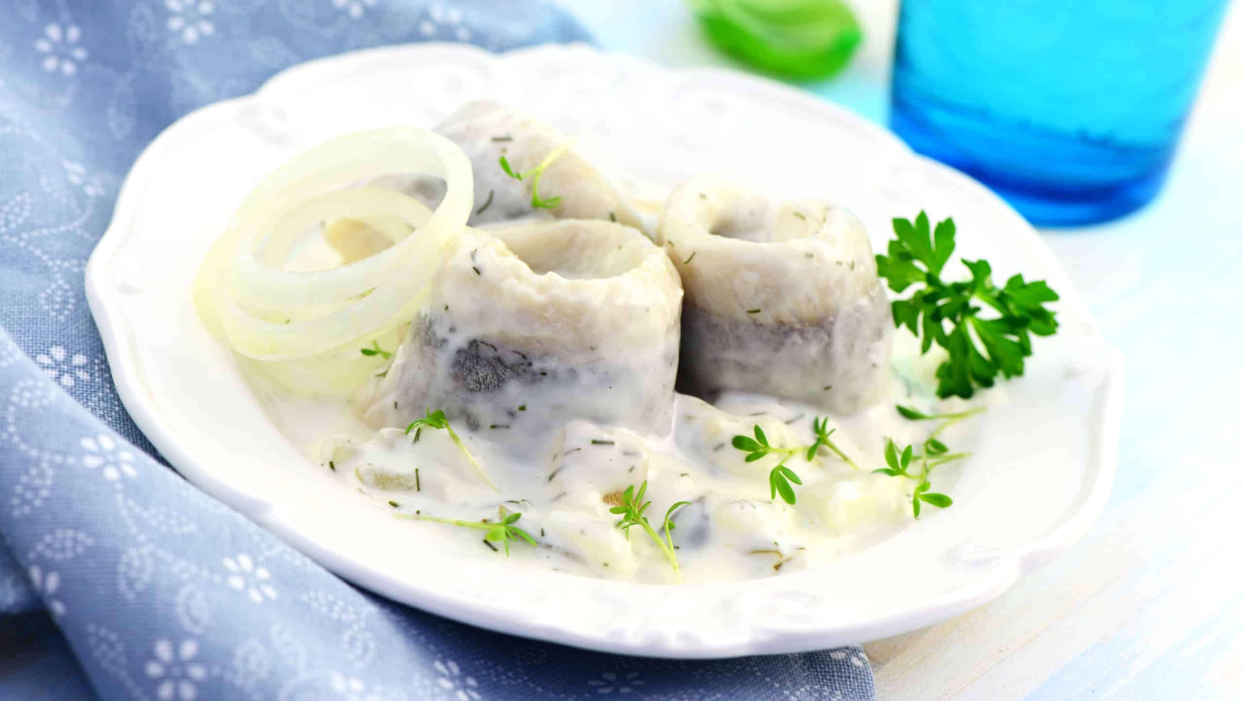 Herring fillets with cream sauce and parsley