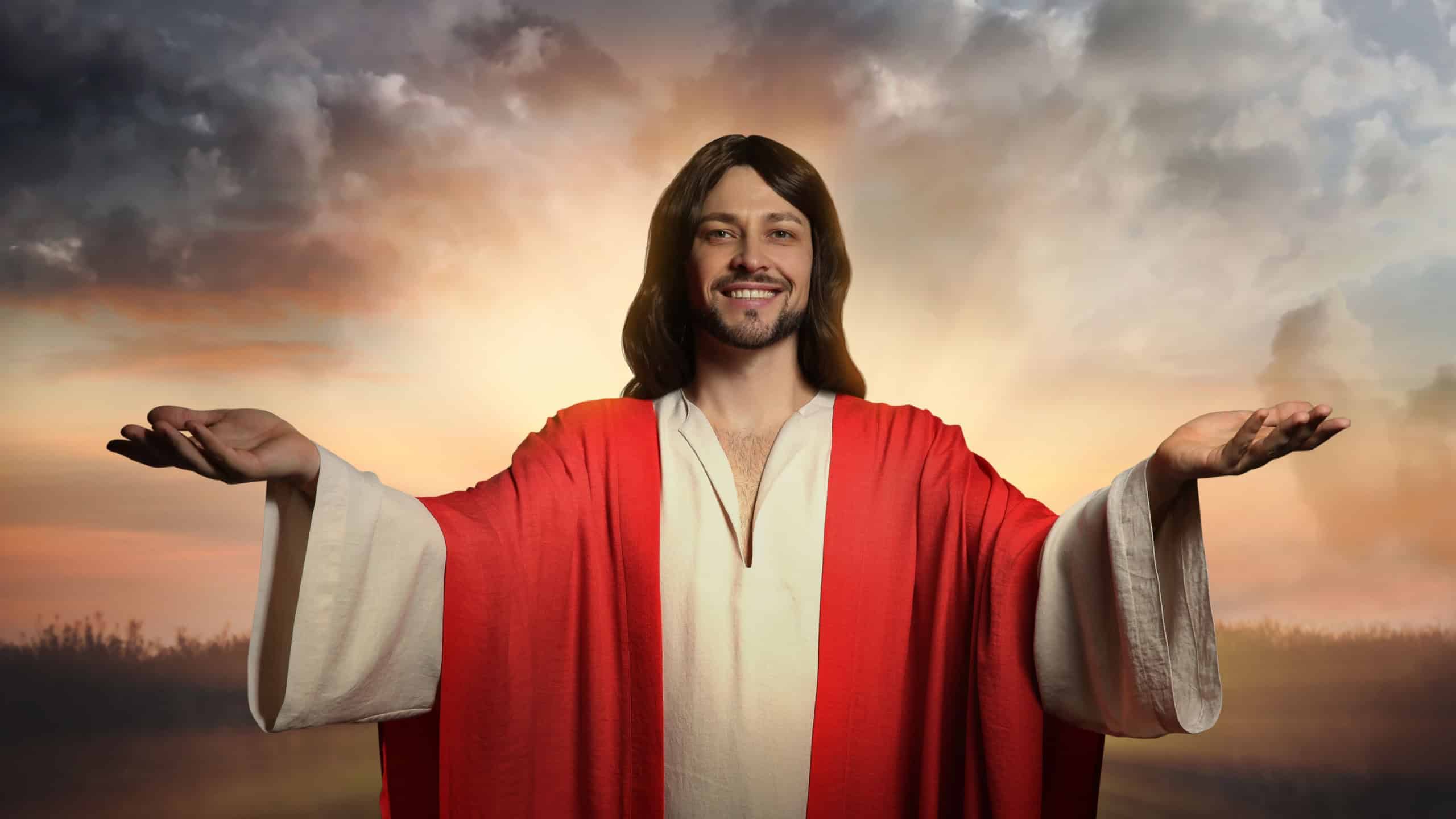 Jesus Christ with outstretched arms outdoors