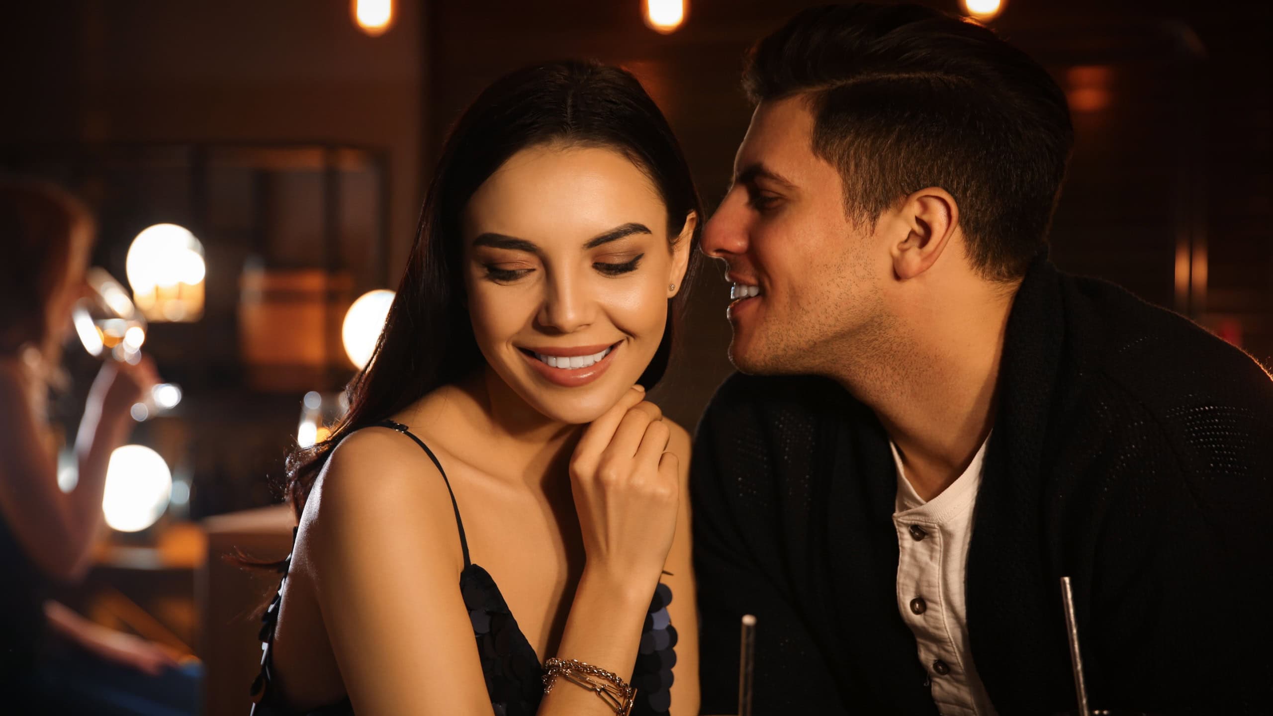 Man and woman flirting with each other in bar