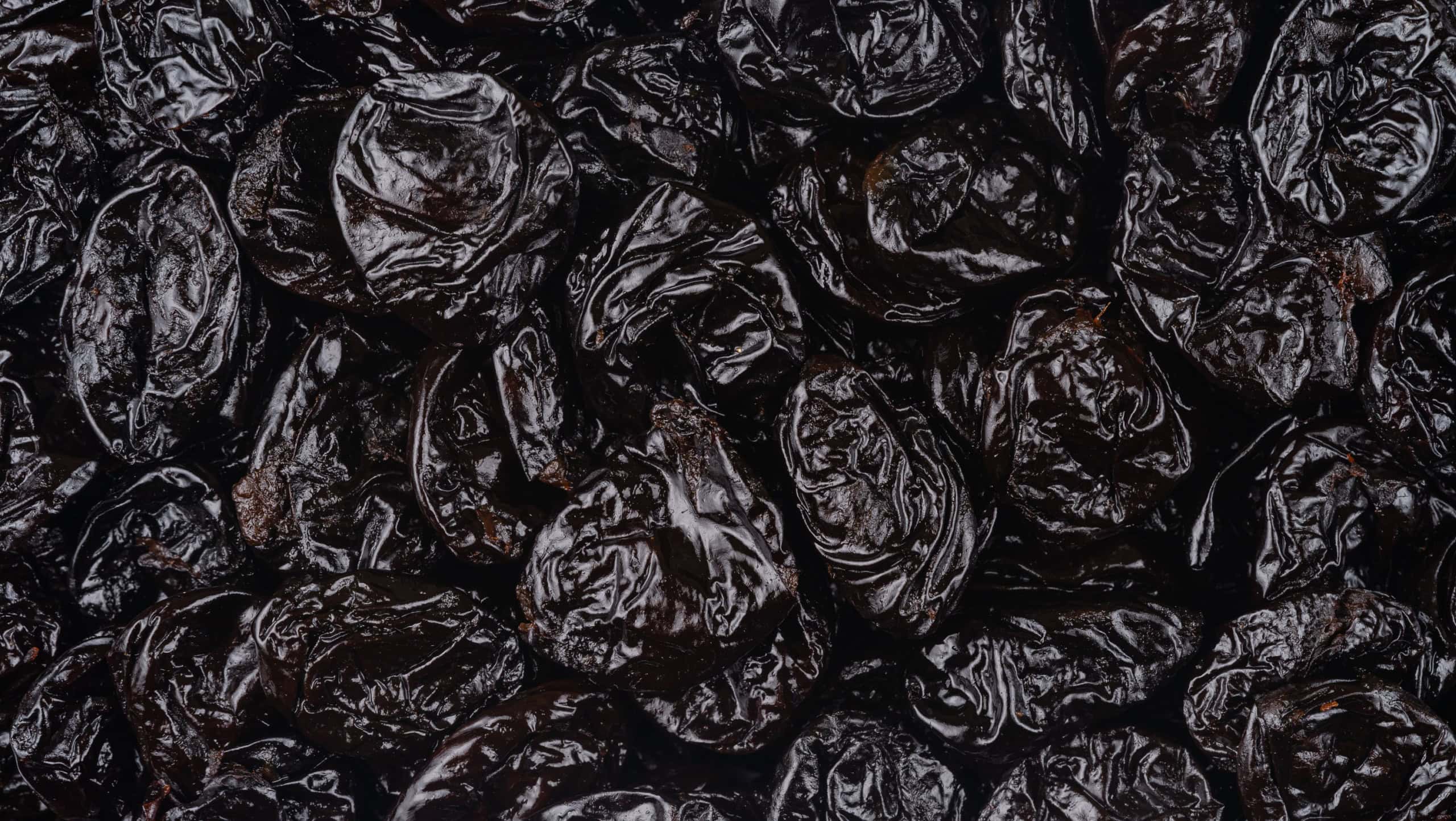 Pattern of dried prunes. Top view, overhead.