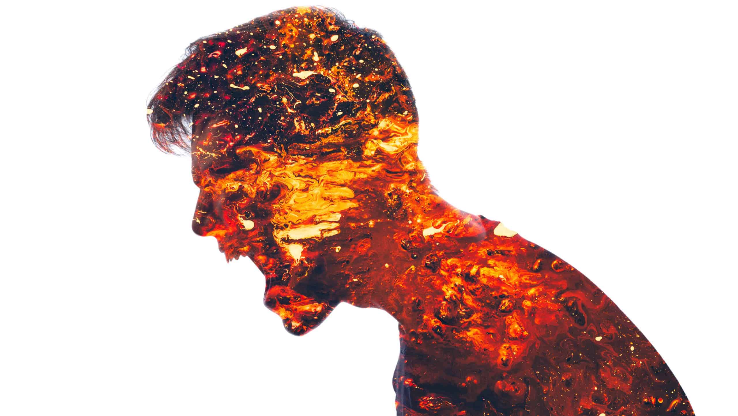 Mad scream. Angry man. Conflict person. Aggression neurosis. Double exposure of furious male silhouette coated in red hot lava isolated on white background.