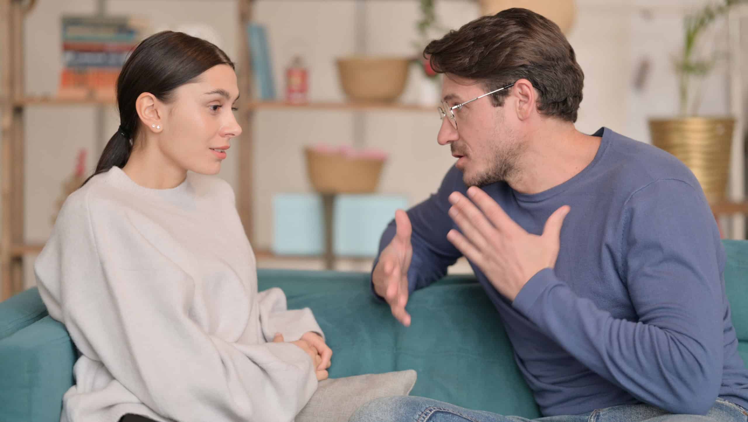 Latin Woman Fighting with Husband While Sitting at Home
