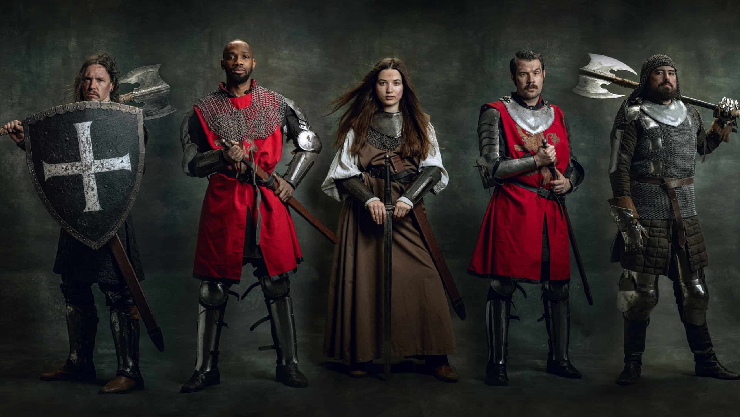 Medieval warriors. Creative art collage with brutal serious multiethnic knights in war clothes with wounded faces holding shield, sword isolated over vintage background. Comparison of eras, history
