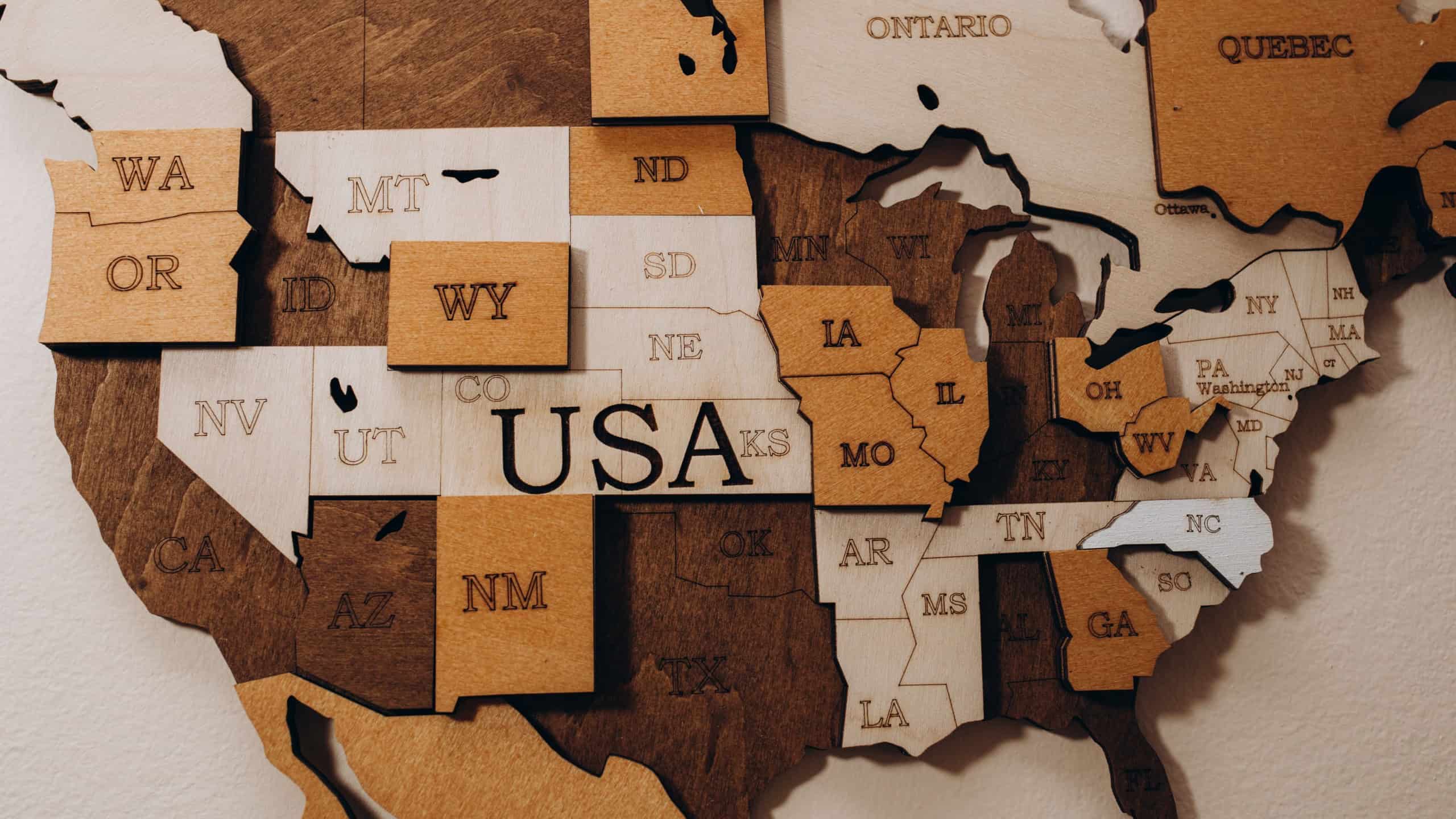 Made in the USA wood sign of US wood map with stars on weathered whitewash wood