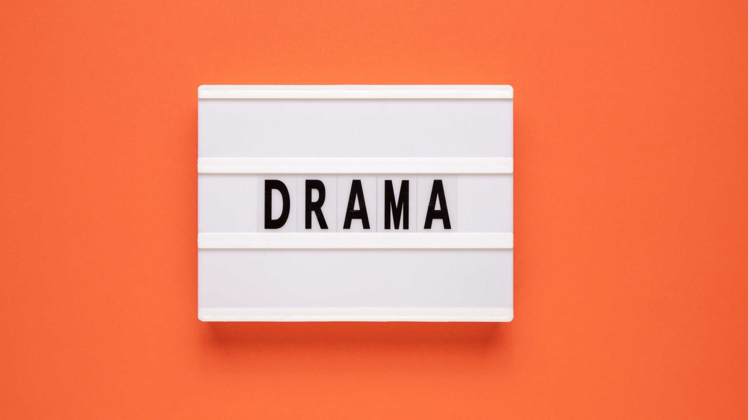 Lightbox with word drama on orange background.
