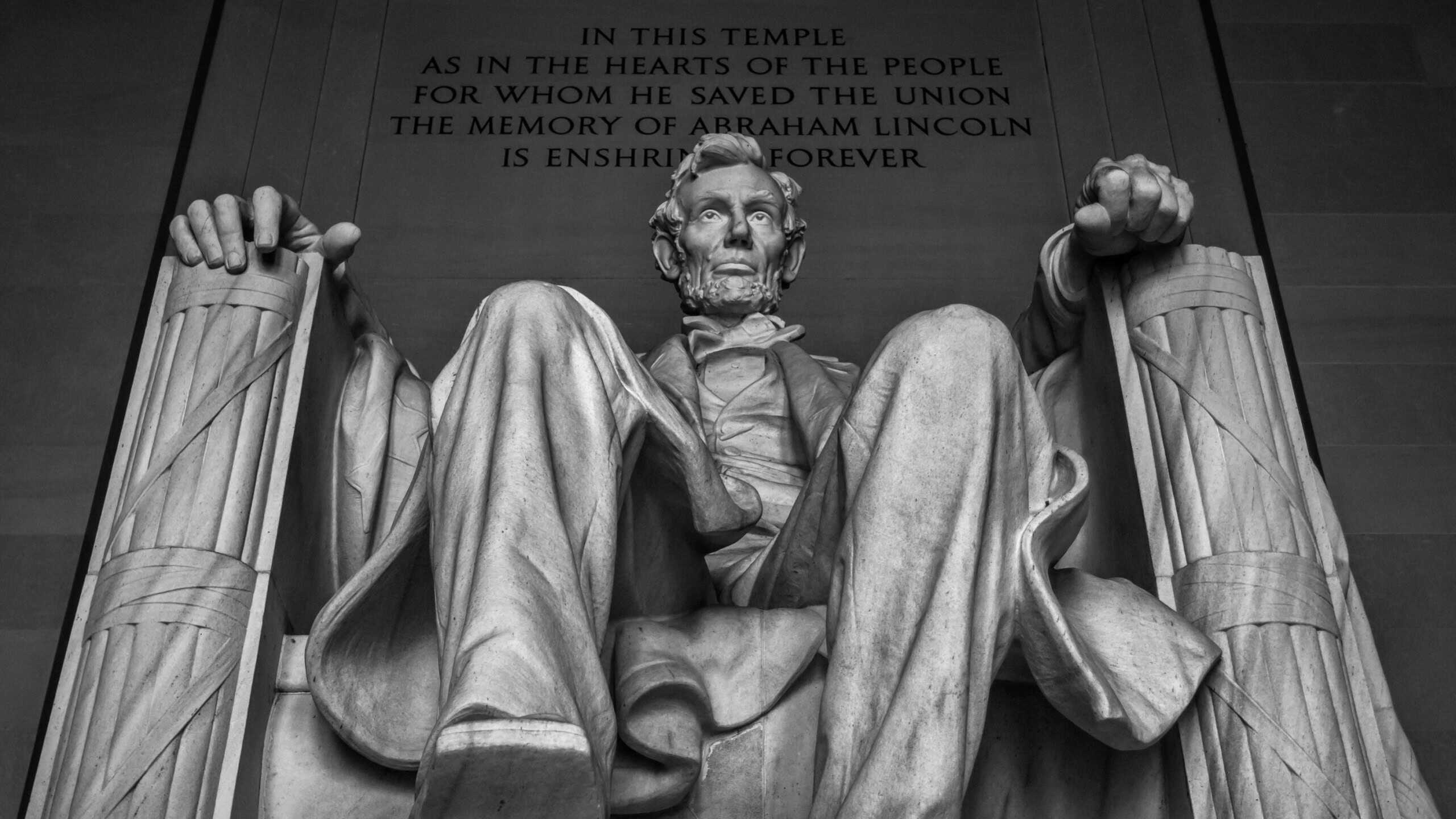 A low-angle shot of the stone Statue of Abraham Lincoln at Lincoln Memorial, Washington DC