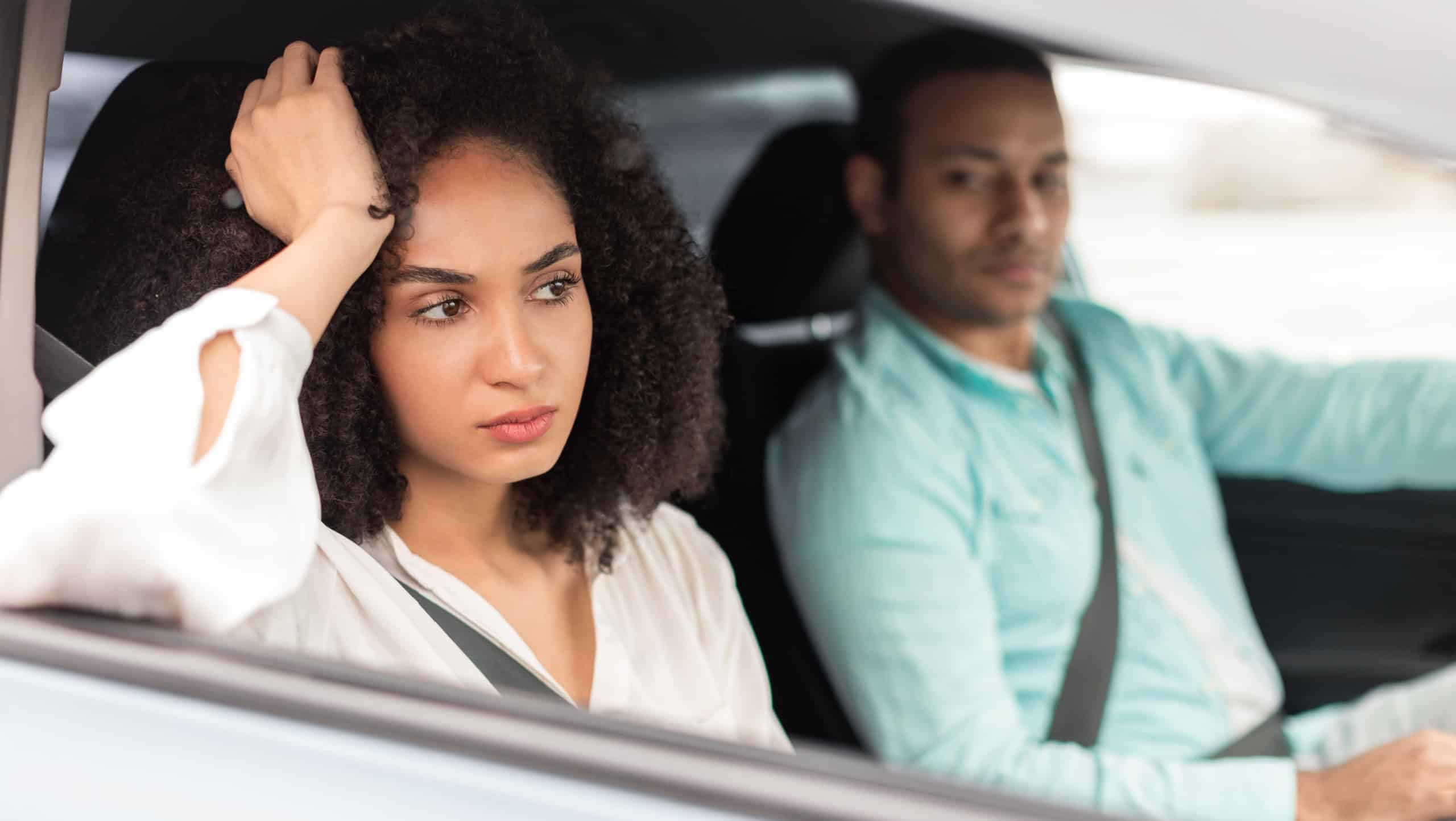 Driving Disagreements. Displeased Middle Eastern Wife Expressing Unhappiness Towards Husband During Car Ride Sitting On Passenger's Seat Inside. Family Conflicts Concept. Selective Focus