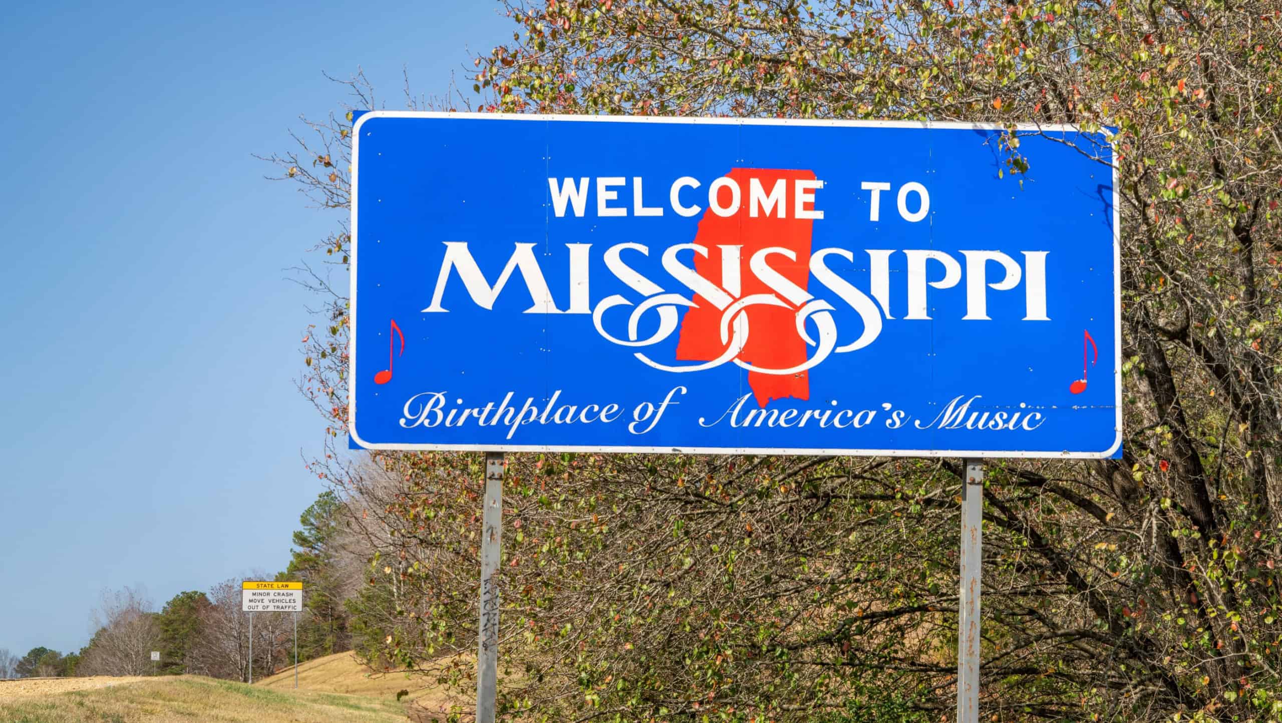 Welcome to Mississippi, Birthplace of America's Music - roadsign at state border with Alabama in late fall scenery