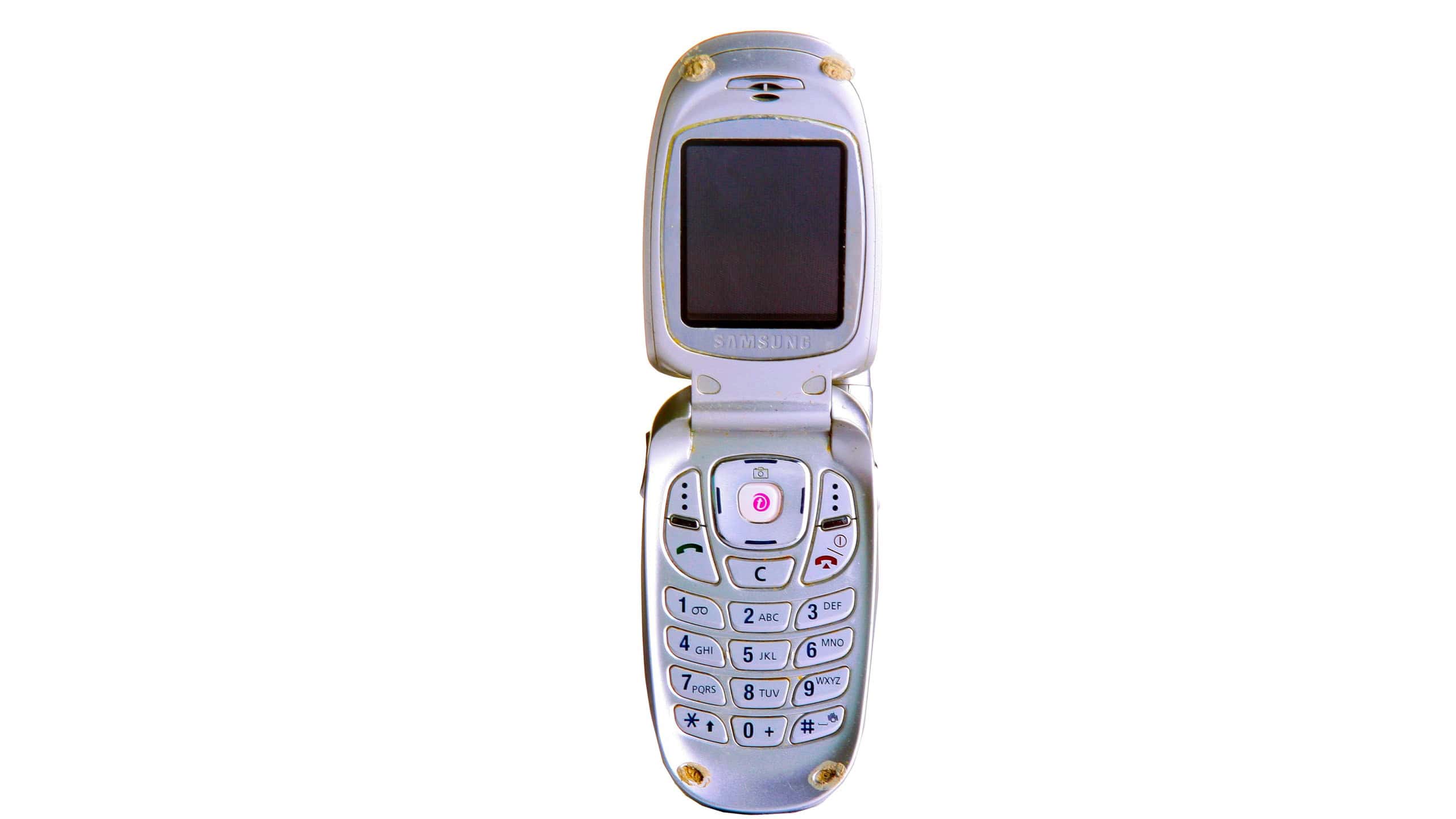 Cell Phone. 2002 Samsung Flip Phone. Mobile Phone. Model CE0862. Old Cellular Telephone. Isolated on white. Room for text. Cell Phone with Camera