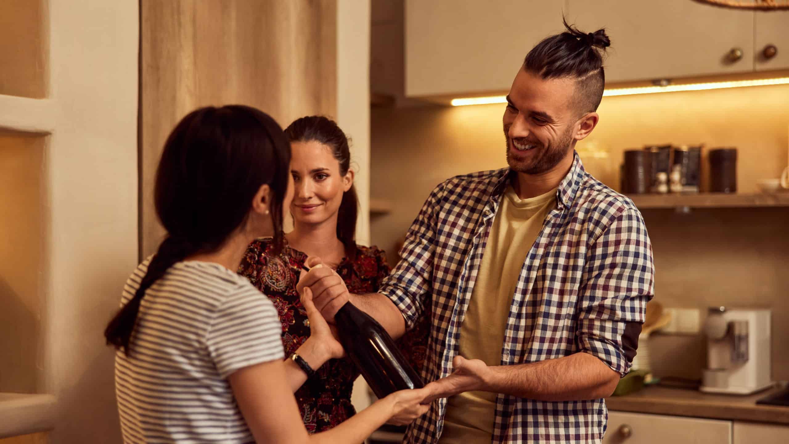 Some friends came to the birthday dinner, giving a bottle of wine as a gift.