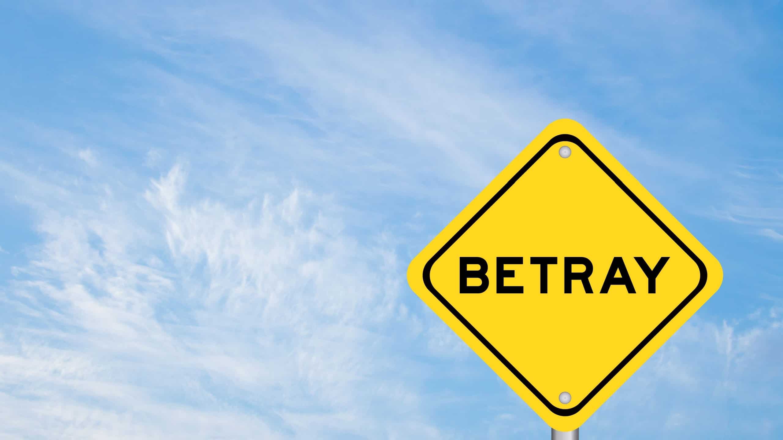 Yellow transportation sign with word betray on blue color sky background