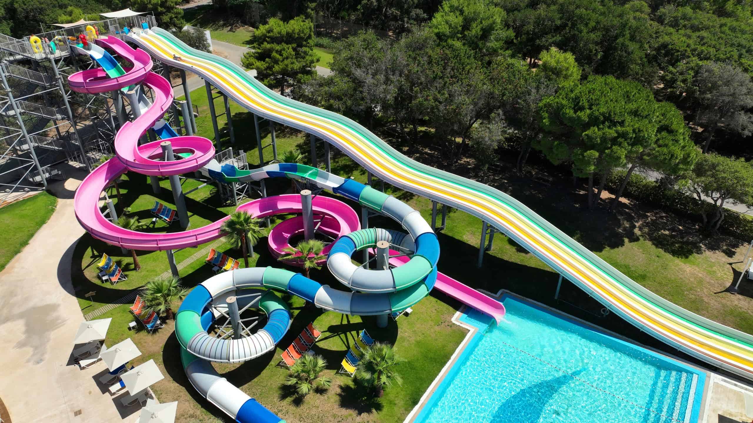 Aerial drone photo of colourful water slide facilities for children in tropical exotic family resort