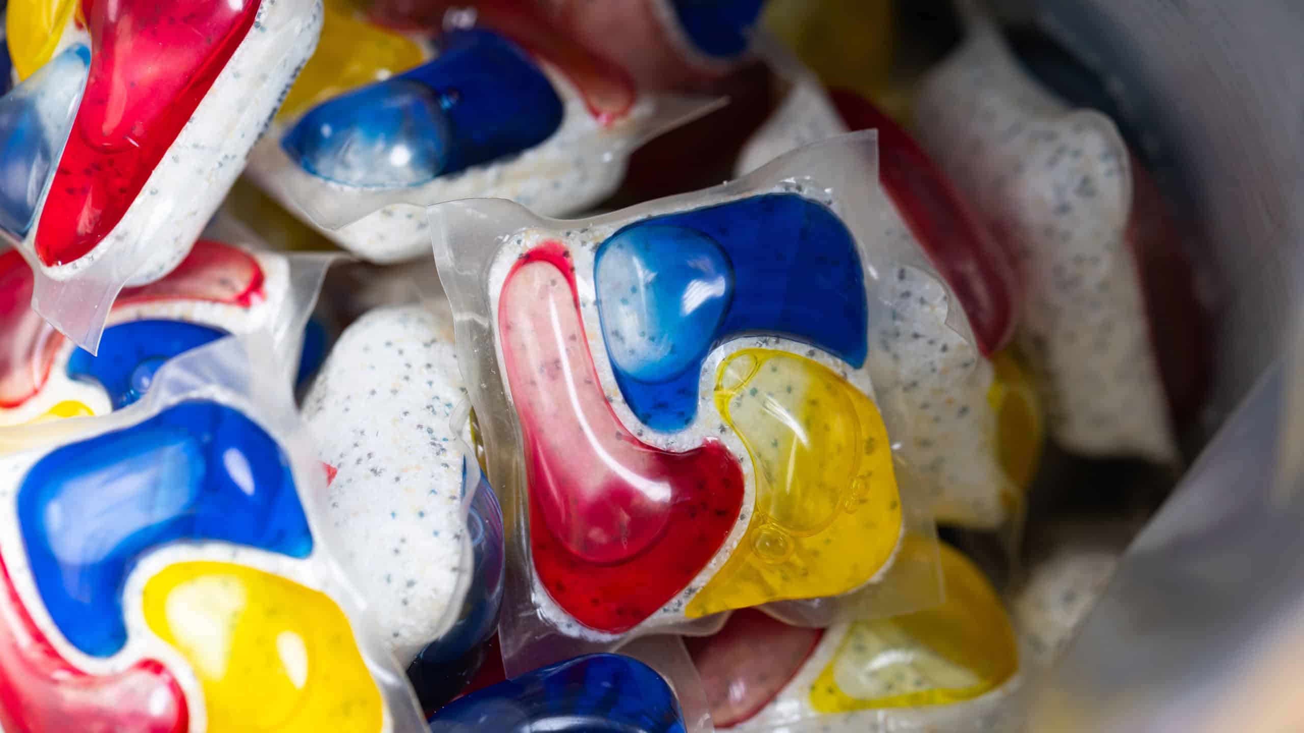 Background of Many Multicolored Dishwasher Detergent Pods