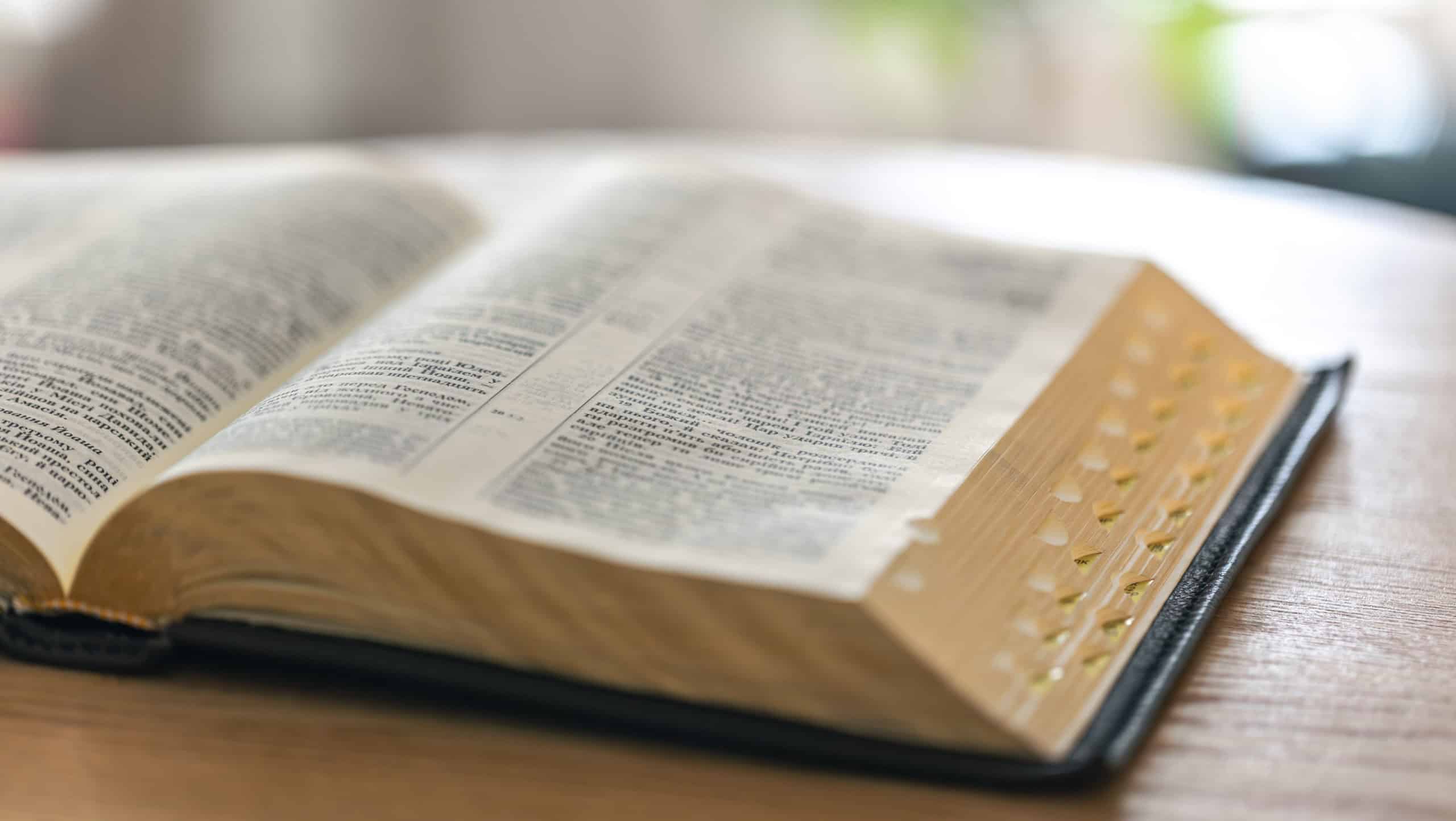 Open Bible as source of spiritual knowledge and faith. Holy scripture.