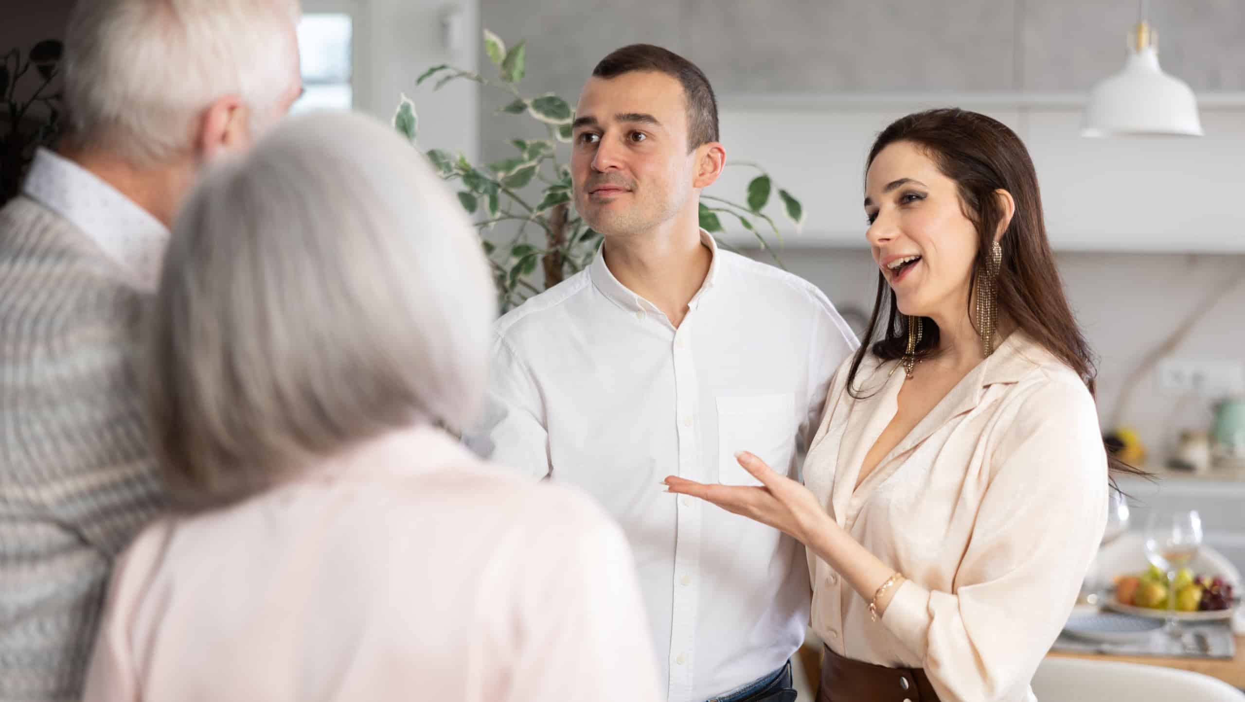 Elderly spouses get acquainted with future son-in-law. Adult daughter introduces her parents to boyfriend. Family gatherings, concept of connection of generations