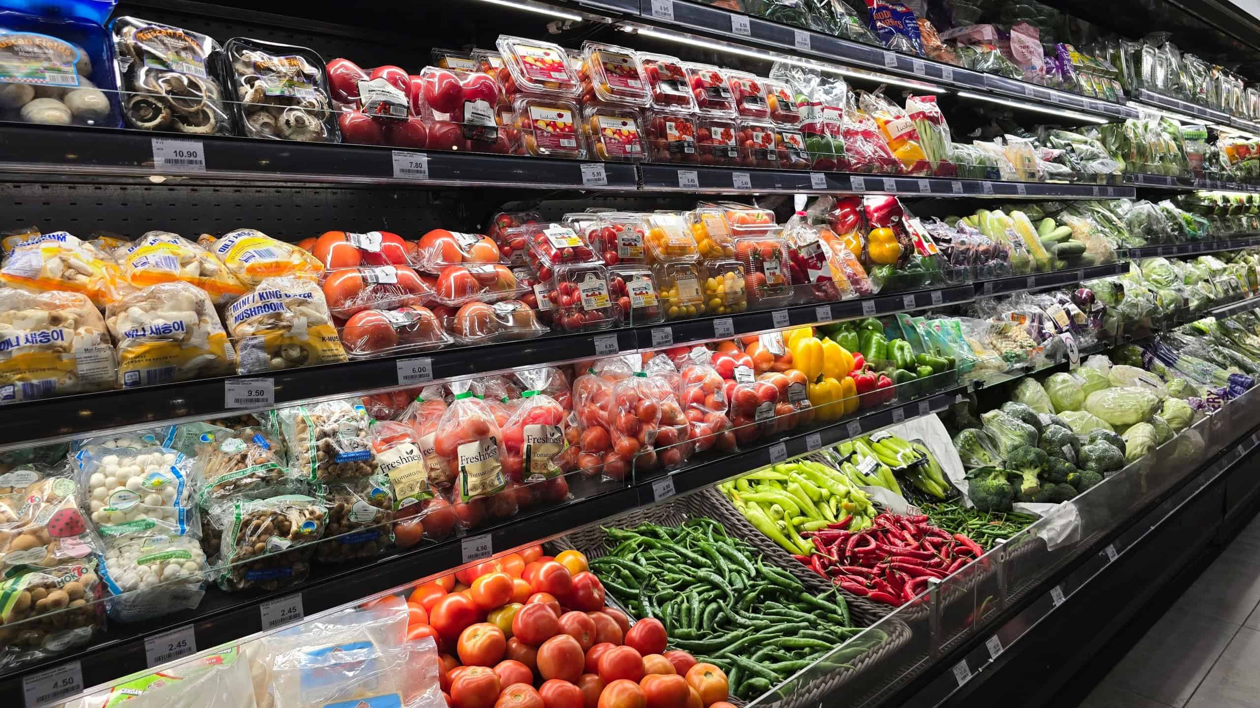 Shelves of fresh vegetables and packaged produce