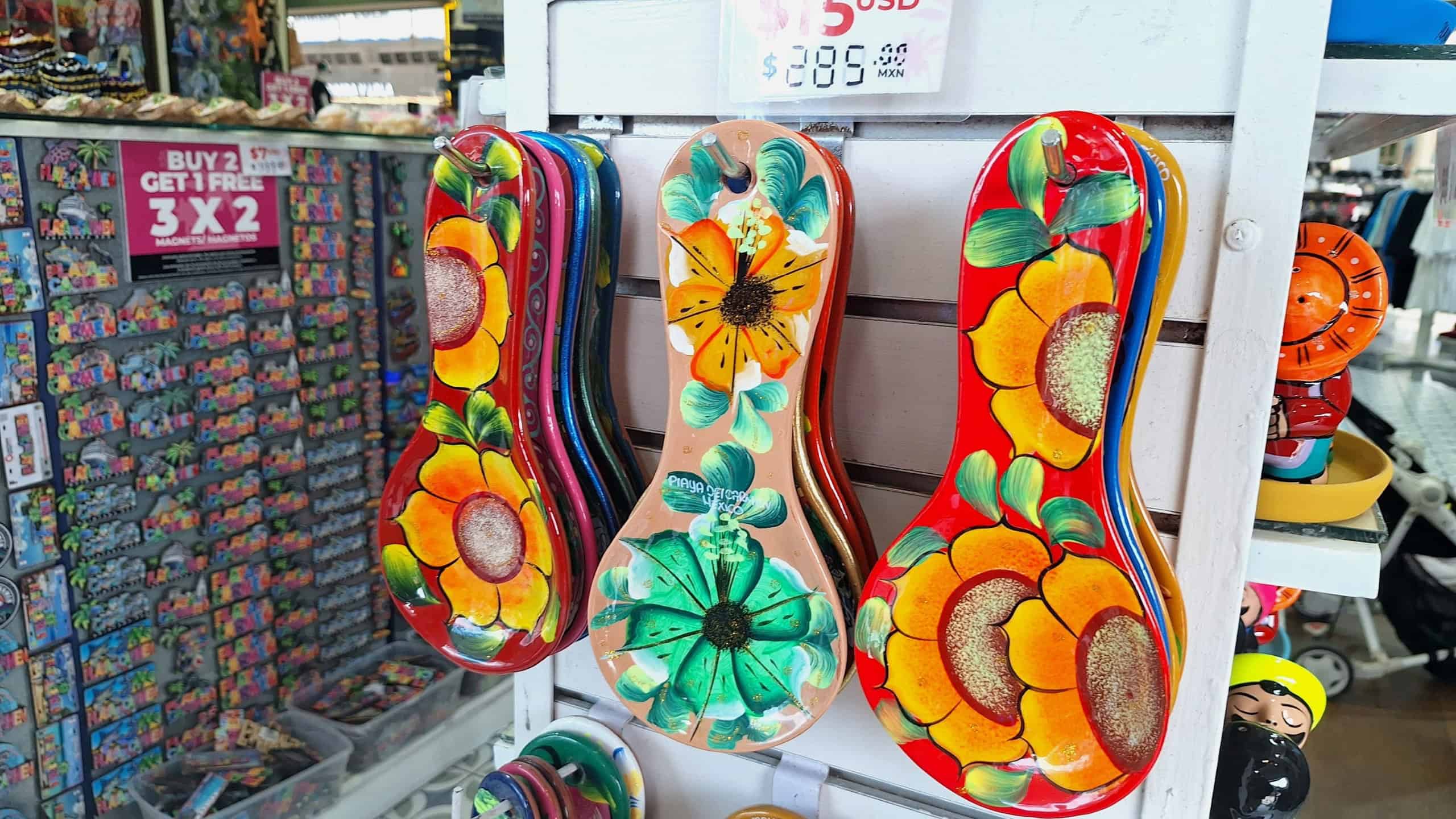 Colorful, hand-painted souvenirs are displayed for sale in a market stall, attracting tourists