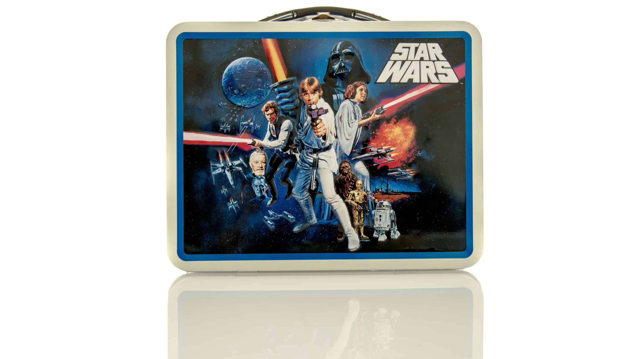 Metal lunch box featuring Star Wars on an isolated background.
