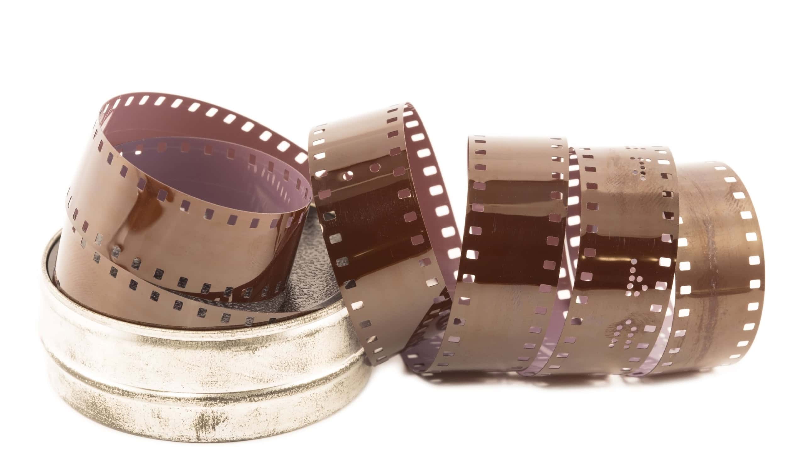 Microfilm strip in metal case isolated
