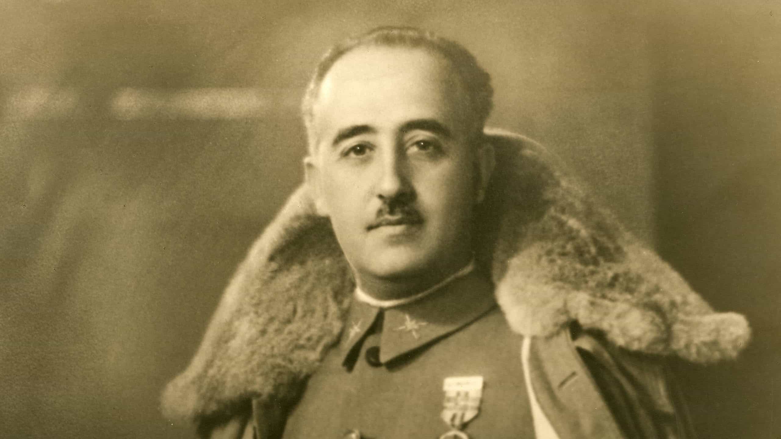 Photograph of General Franco with winter cloak.