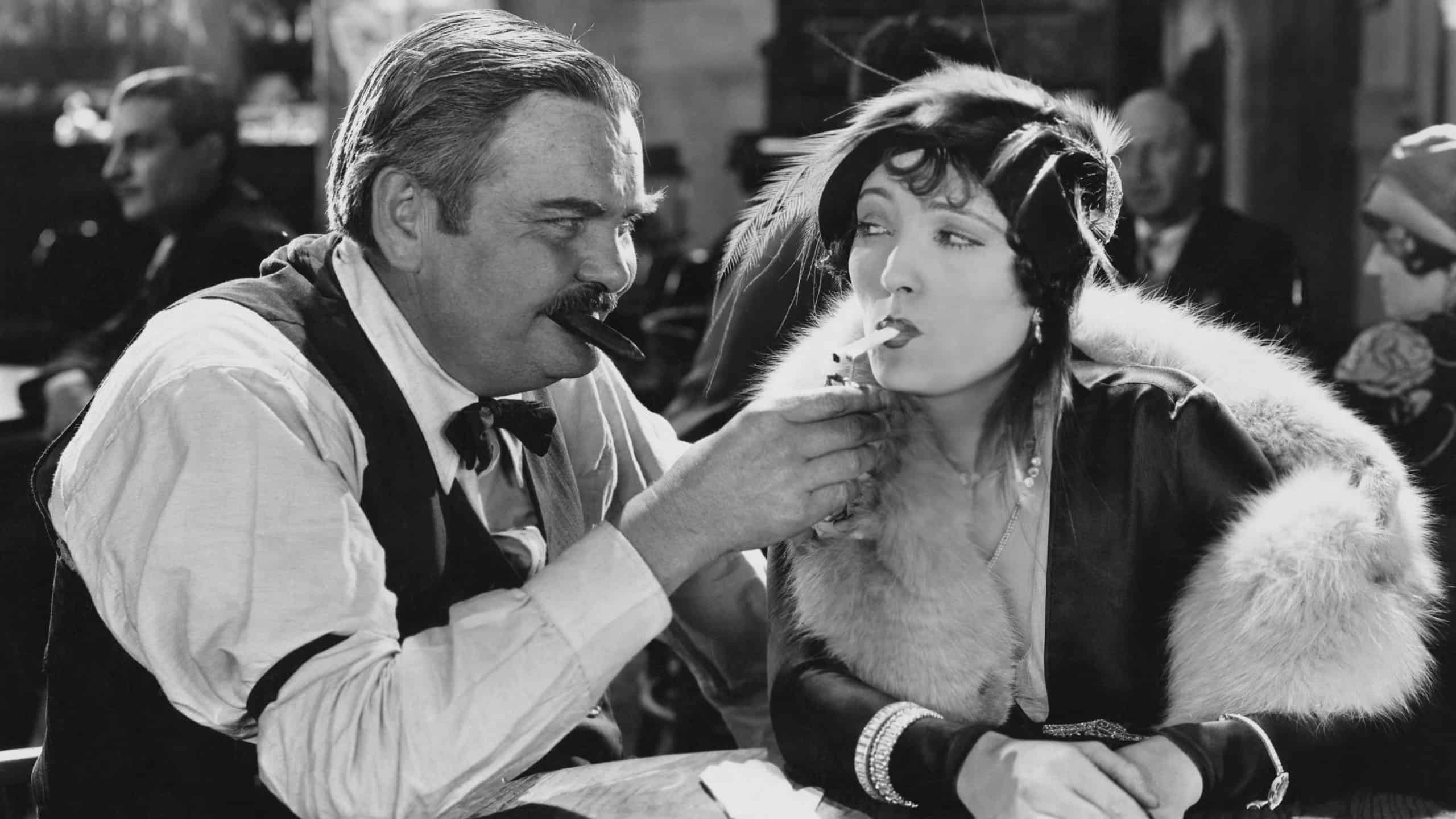 Man lighting womans cigarette