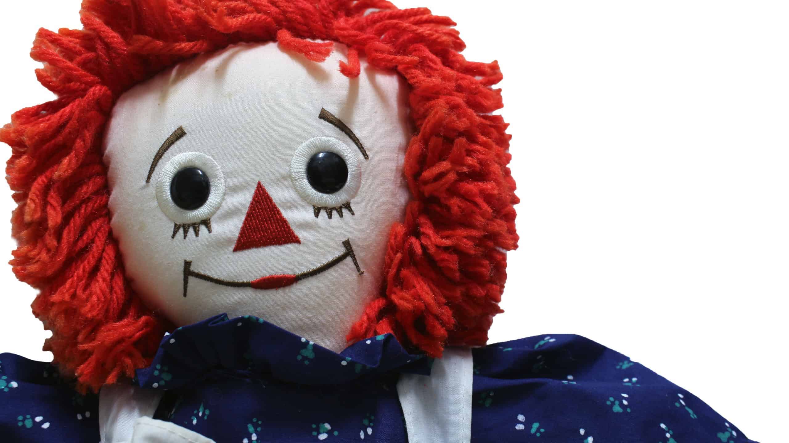 Raggedy Ann doll on white background, Old Time Rag Doll, Ghost mystic doll. Scary horror doll