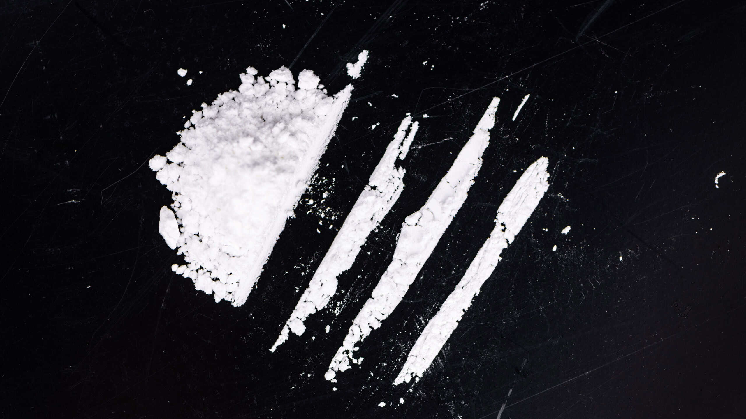 Portion of Cocaine on a dark plate as detailed close-up shot