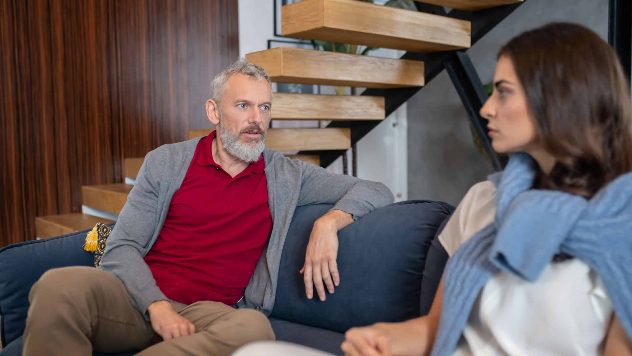 Talking seriously. Man having a serious conversation with his young spouse