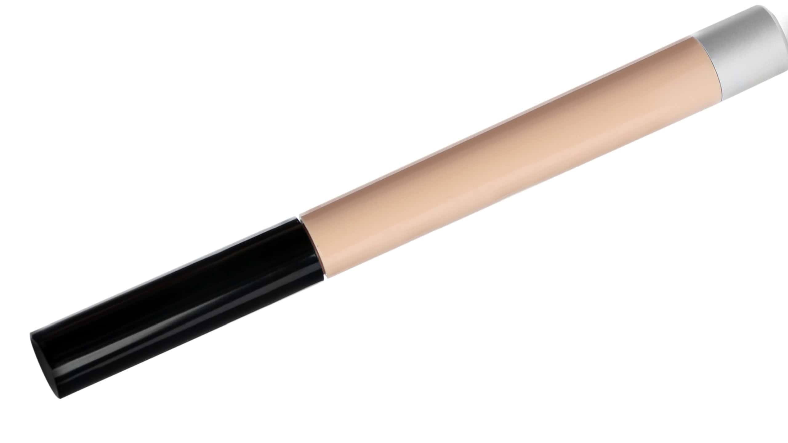 Stick concealer isolated on white. Makeup product