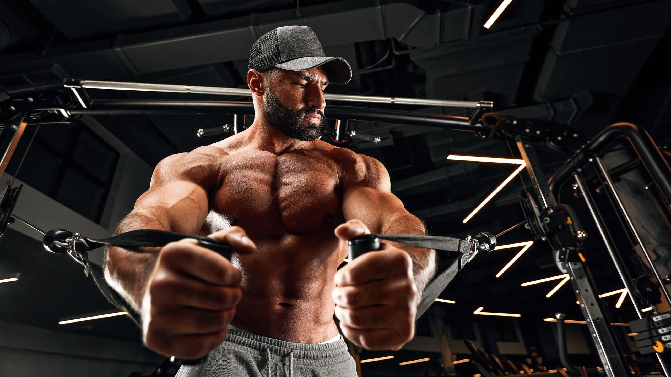 bald brutal sexy strong bodybuilder athletic fitness man pumping up abs muscles workout bodybuilding concept background