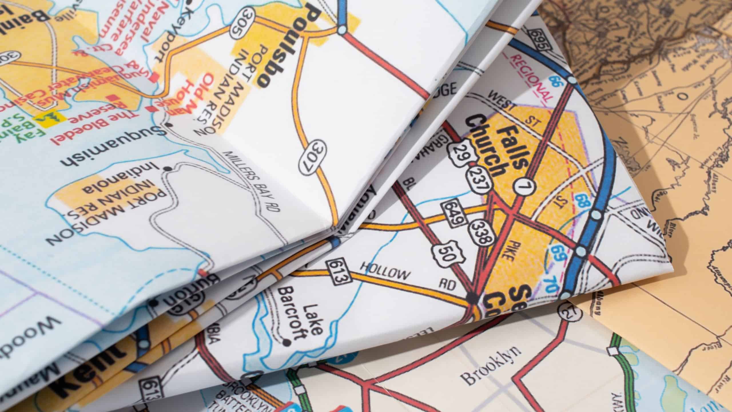 Travel concept. pile of maps of europe and usa, cluseup