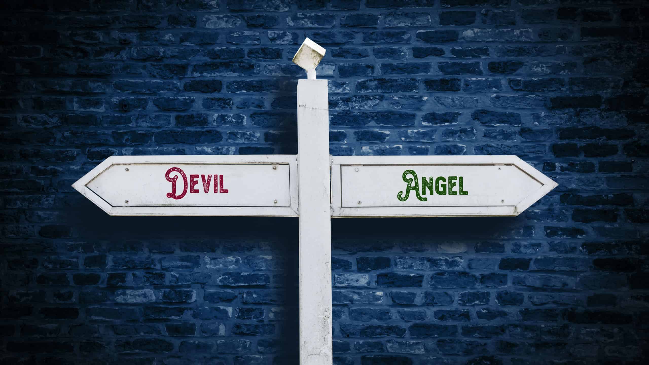 Street Sign the Direction Way to Angel versus Devil