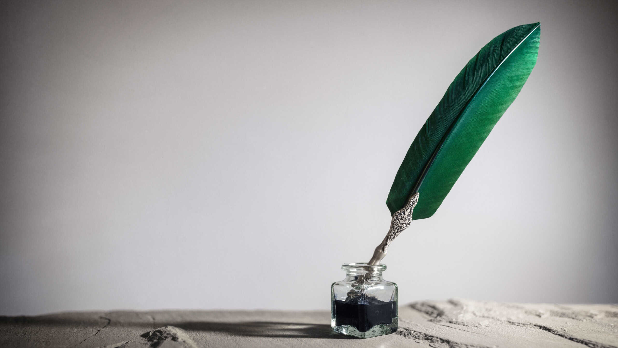 Quill pen and inkwell background concept for literature, writing, author and history