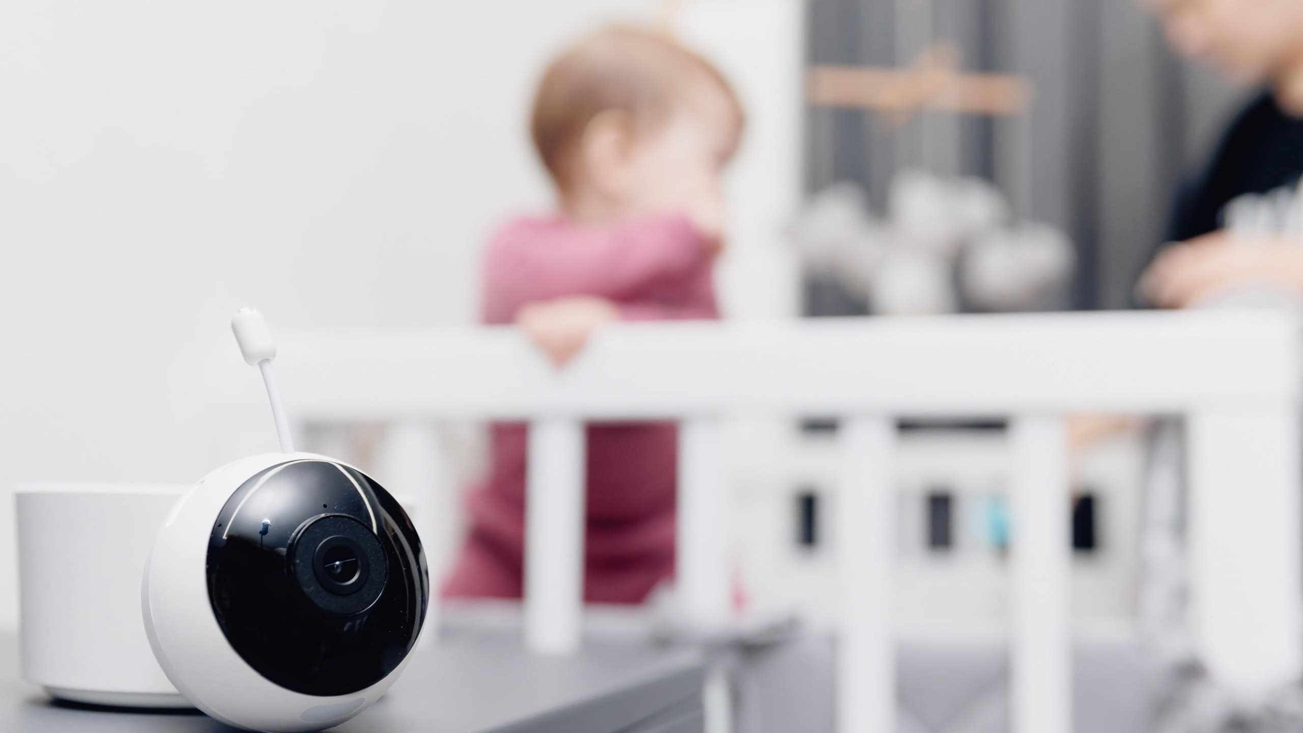 CCTV for baby, Video nanny camera near crib with child in room.