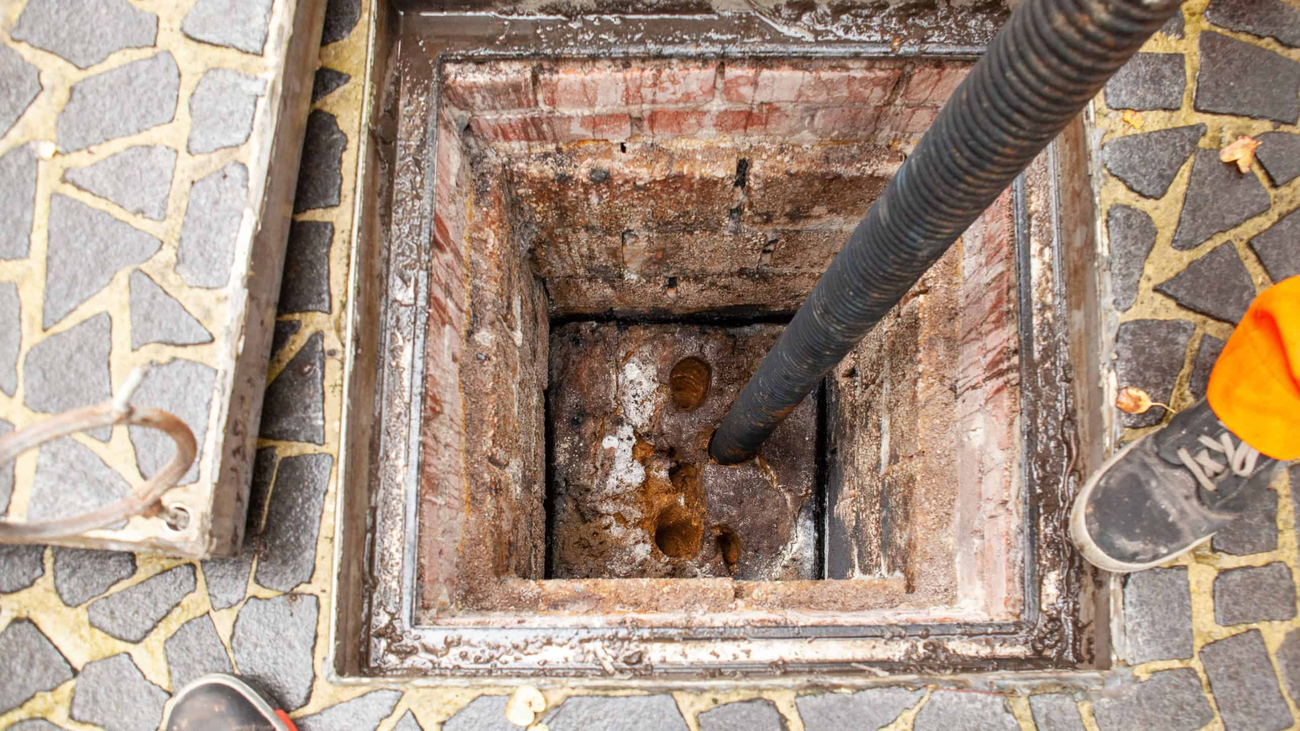 Next to a large building for the students, the Cesspool overflows