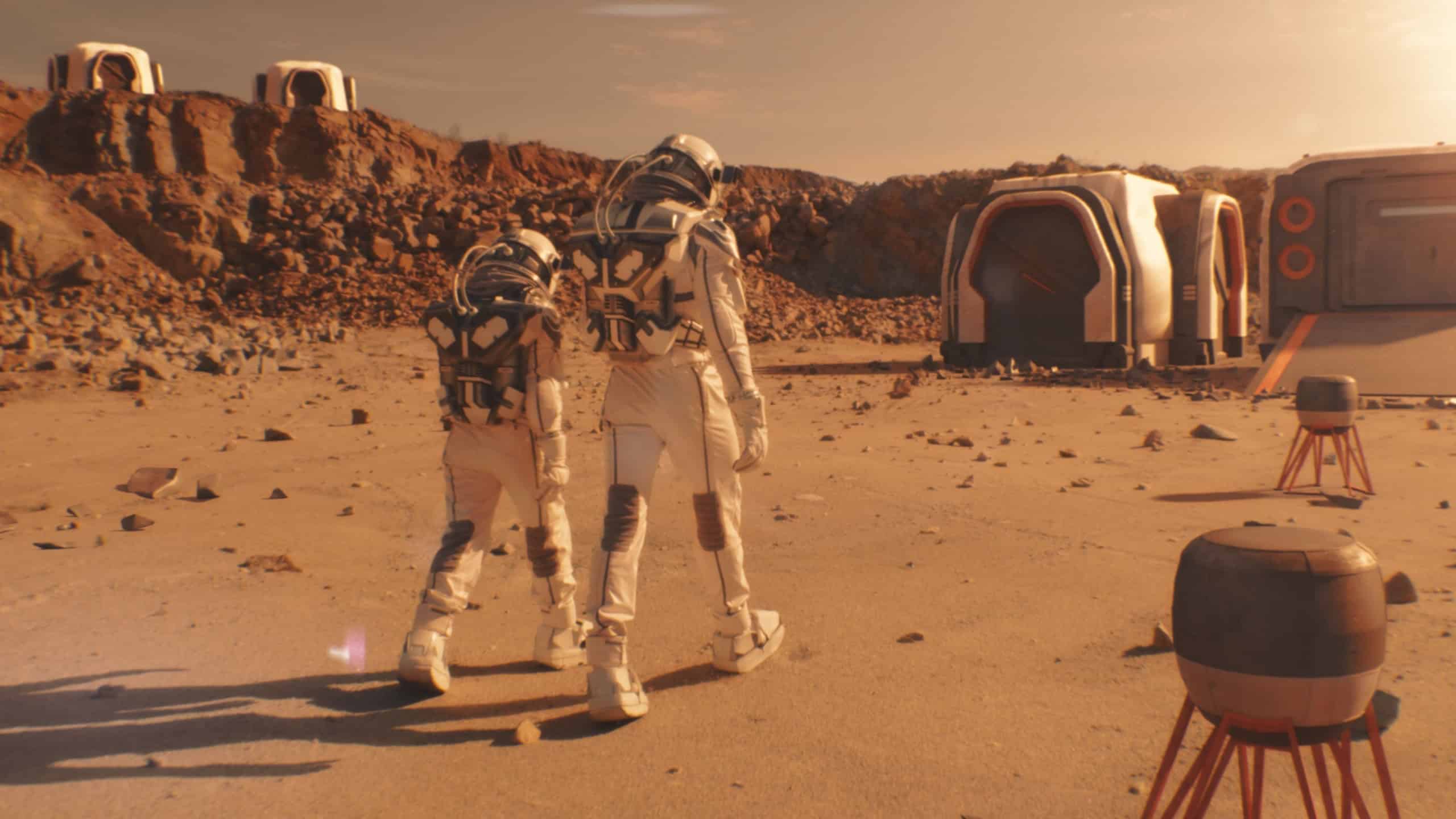 Two astronauts in spacesuits walk toward research station, colony or scientific base on Mars. AI powered rover rides in the background. Space mission. Futuristic colonization and exploration concept.