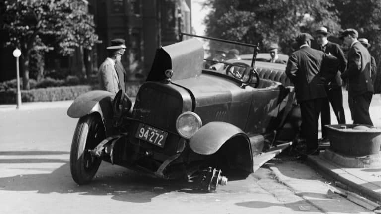 Auto accident, closeup of a car accident, photograph circa 1918-1920.
