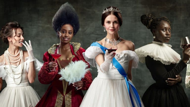 Elegant medieval women, princess, queens in beautiful period dresses drinking red wine against vintage green background. Concept of comparison of eras, retro and vintage, history. Creative collage
