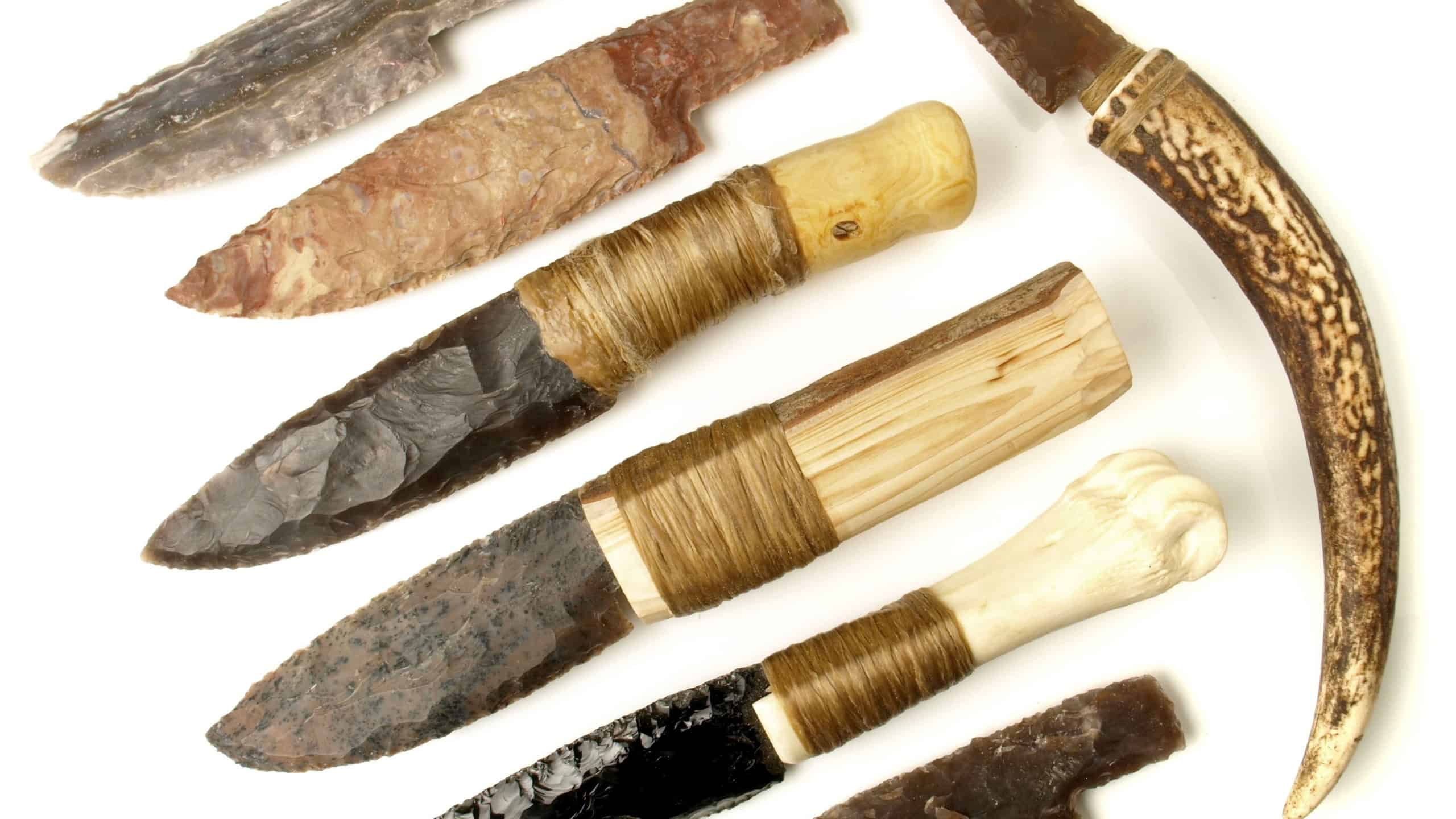 Stone Age Knives with Flintstone and Obsidian Blade isolated on white Background