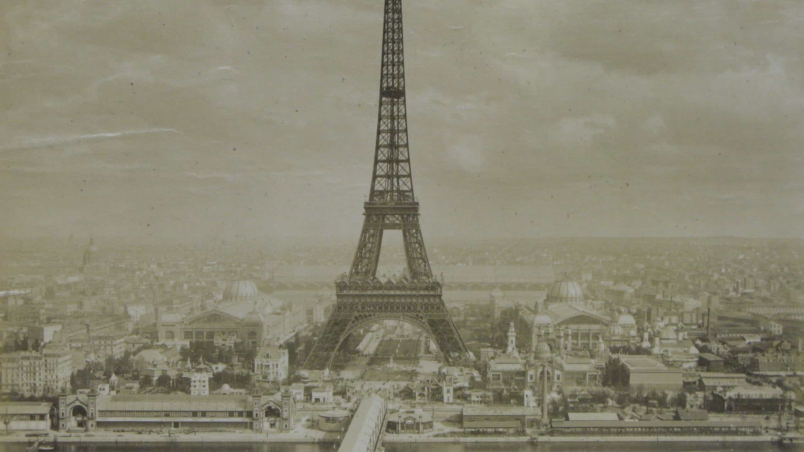 Vintage photo of the Eiffel Tower in Paris. The Eiffel Tower stands tall in the Paris skyline. Historic view of the Eiffel Tower and Paris cityscape. Vintage art.
