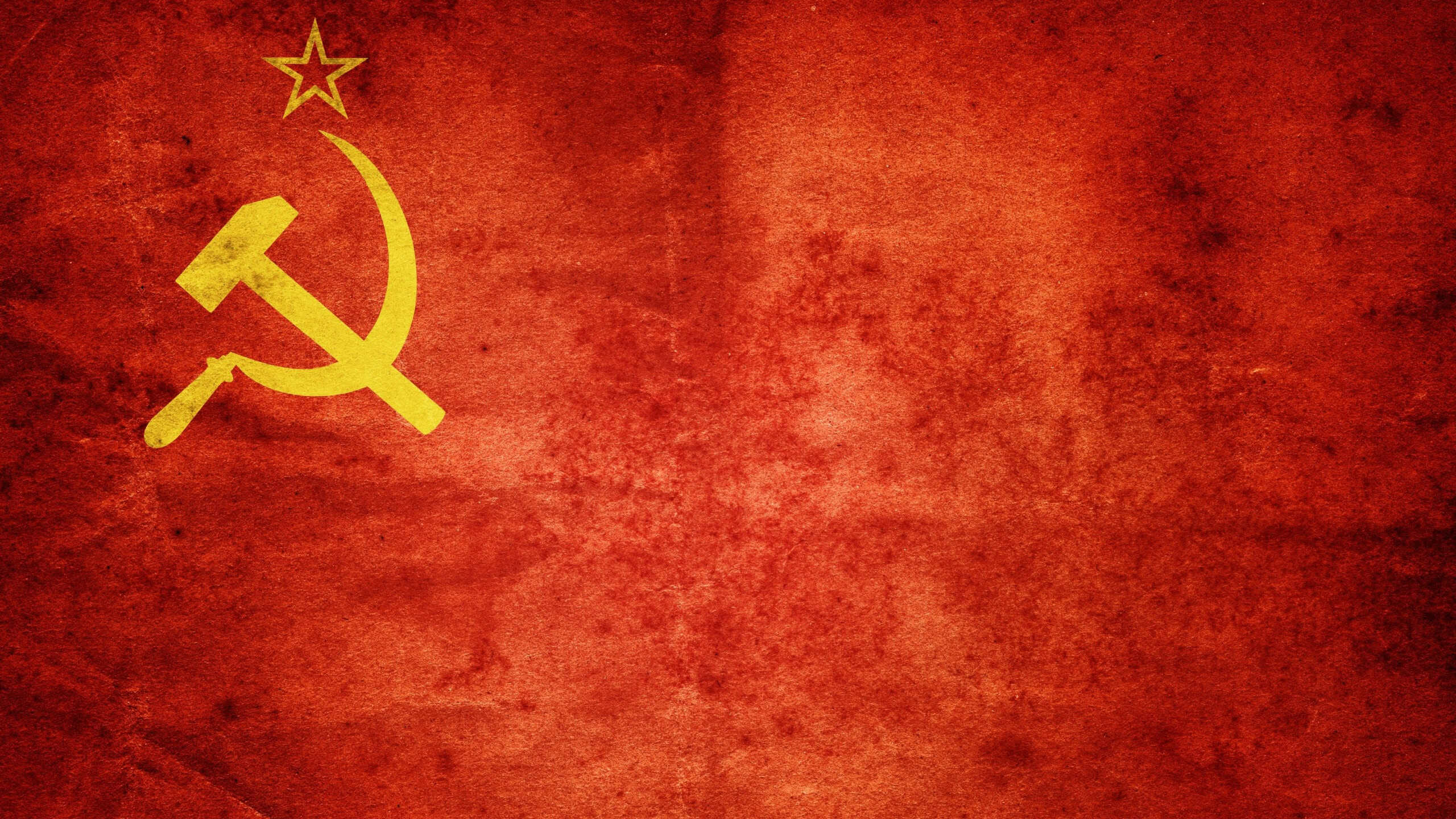 Background of the USSR flag. Symbol of socialism, communism and the Soviet Union. Empire of evil. Historical collage.