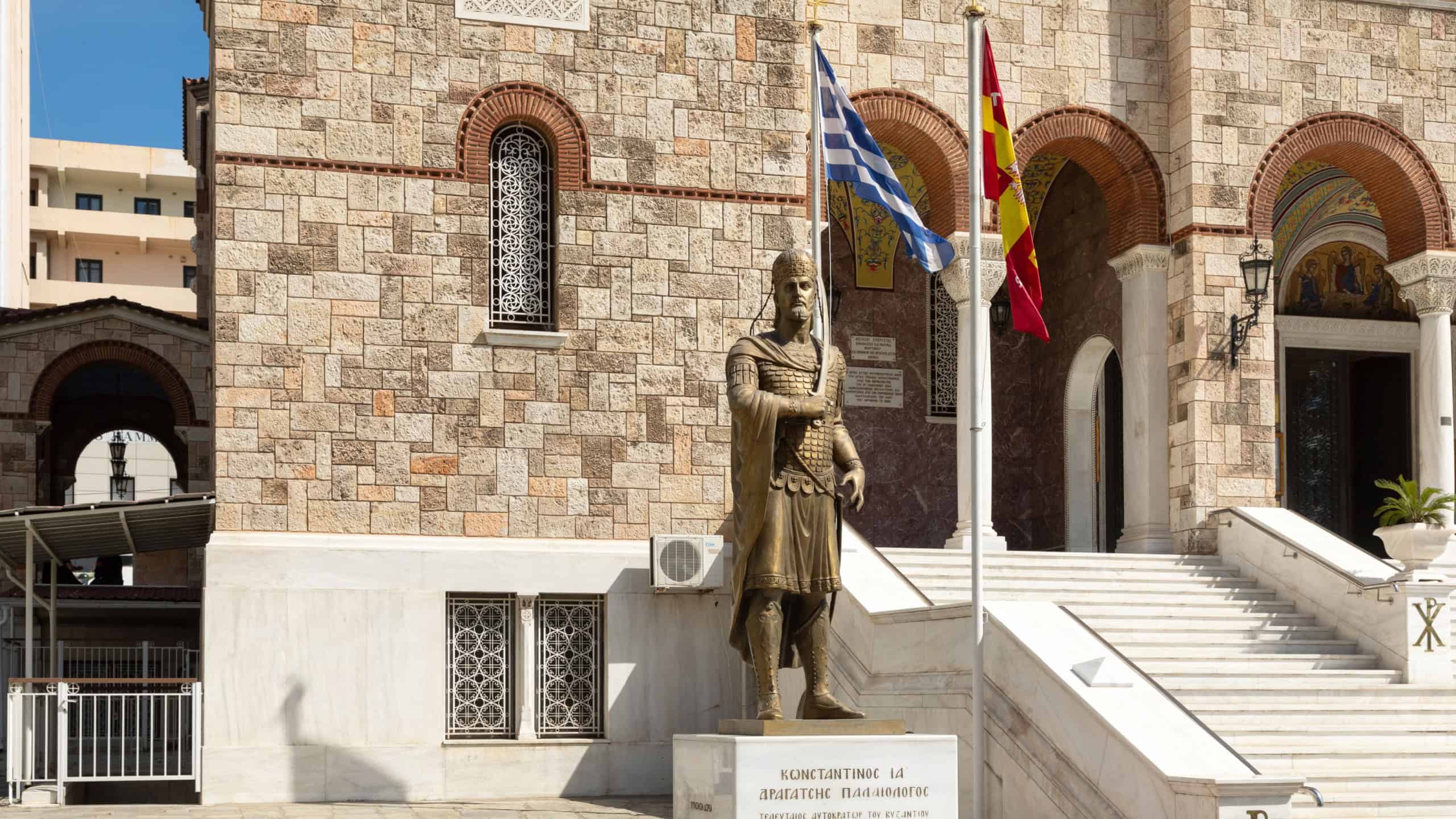 Athens, Greece - May 02 2025: The statue of Constantine XI Palaiologos, located near the Holy Cathedral Church of Holy Trinity of Piraeus
