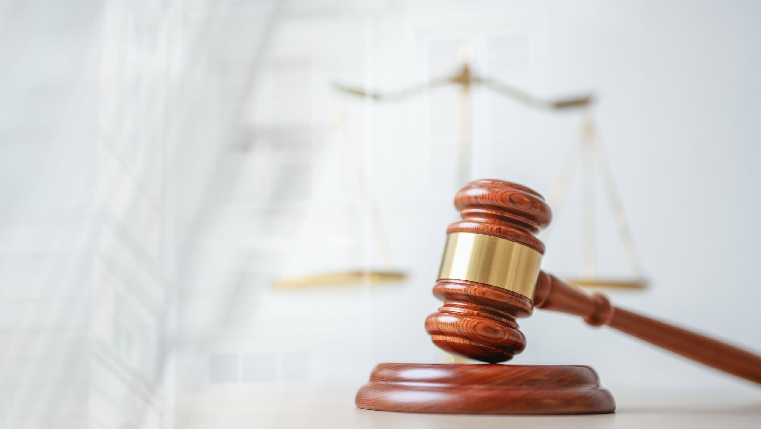 Law concept. Justice criminal legal. Hammer judge. Lawyer judgment gavel. Judgment court. A wooden gavel is placed on a wooden stand in front of a scale. The gavel is a symbol of authority.