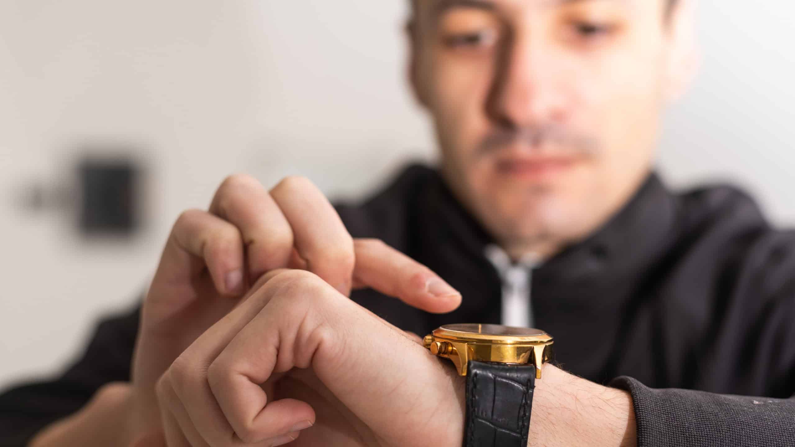 Men's wrist watch, the man is watching the time
