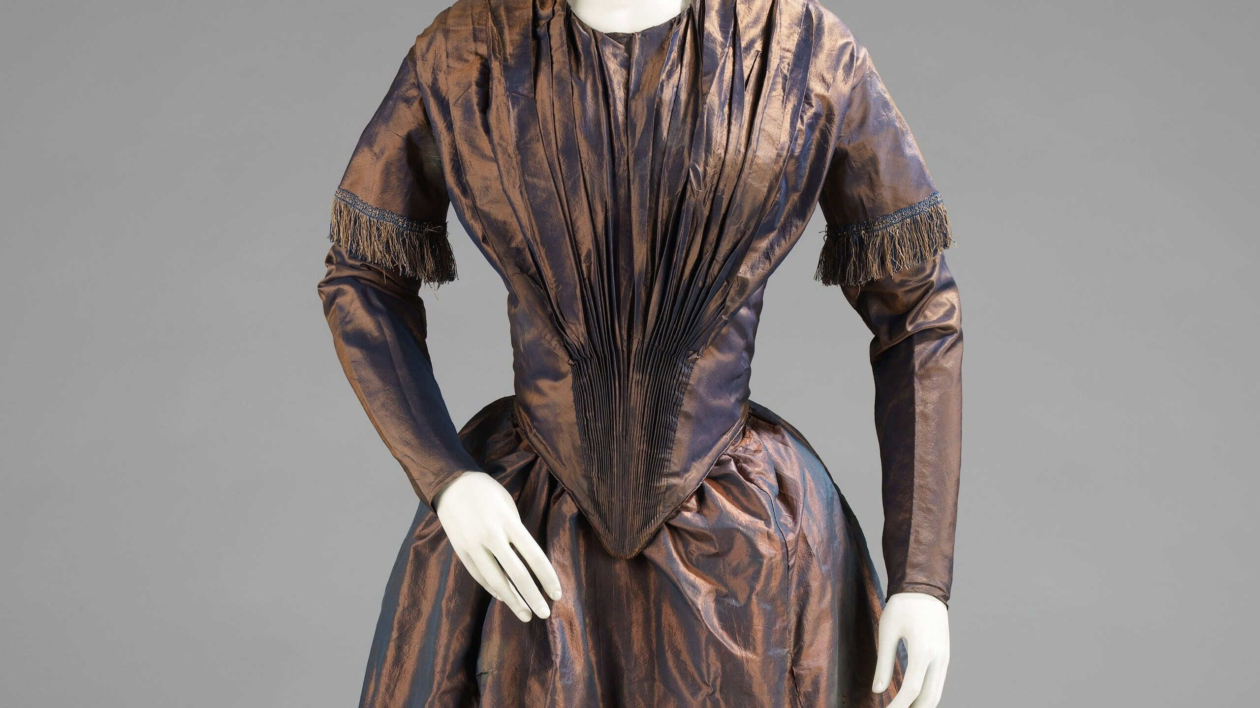 Elegant vintage dress with intricate design. Victorian-style gown features rich fabric and detailed tailoring. Historical fashion with classic, timeless elegance. Vintage costume art.