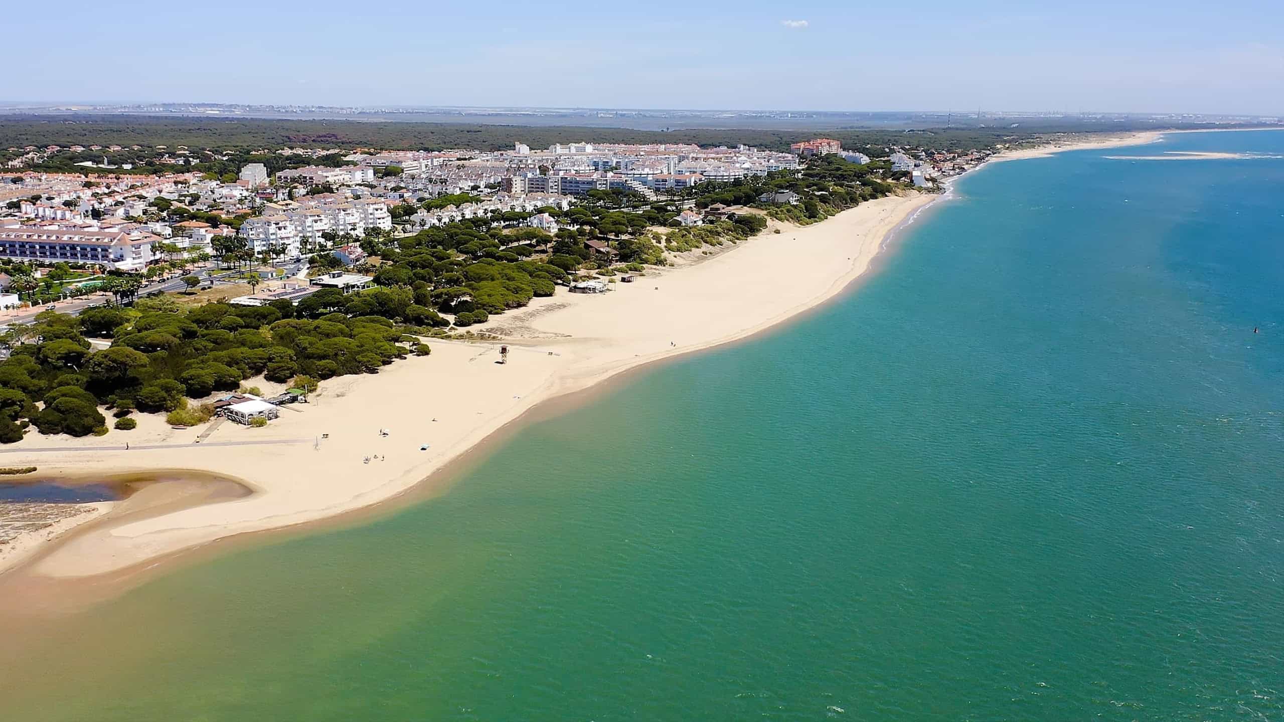 Aerial view of the beautiful beaches and marinas of El Rompido in the province of Huelva, Andalusia, Spain.