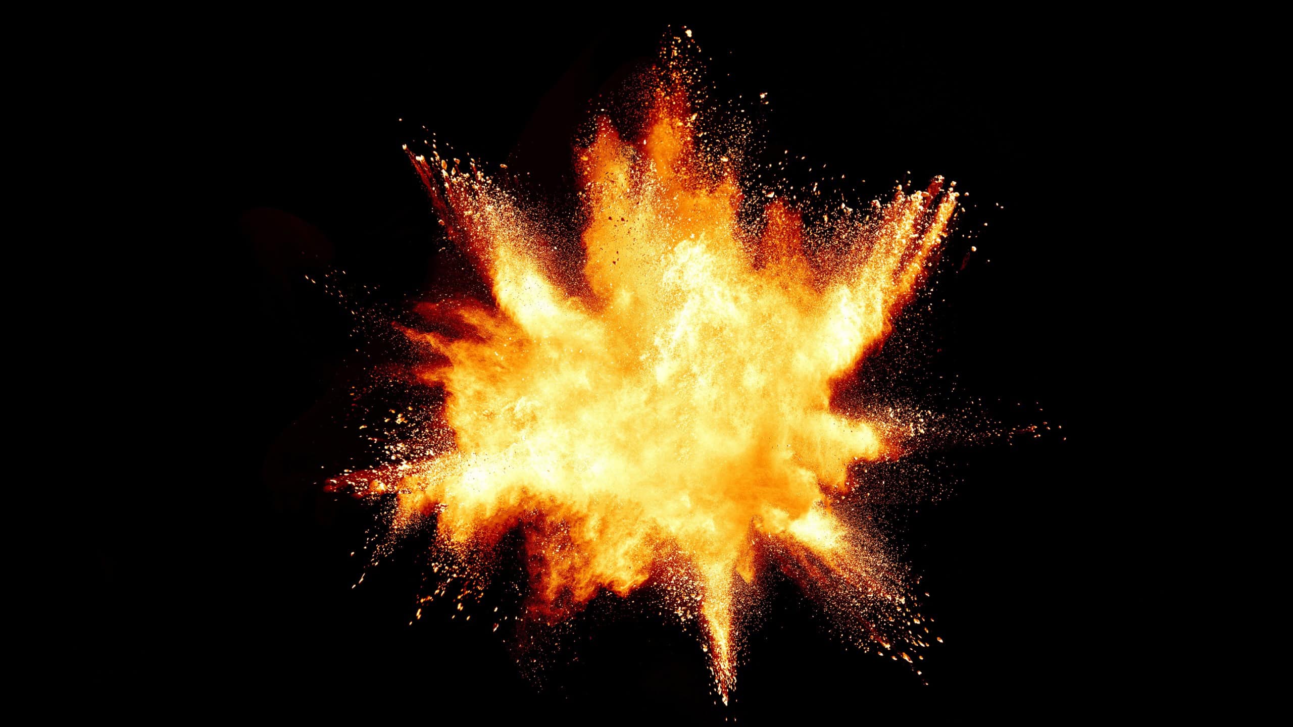 Launched orange powder on black background