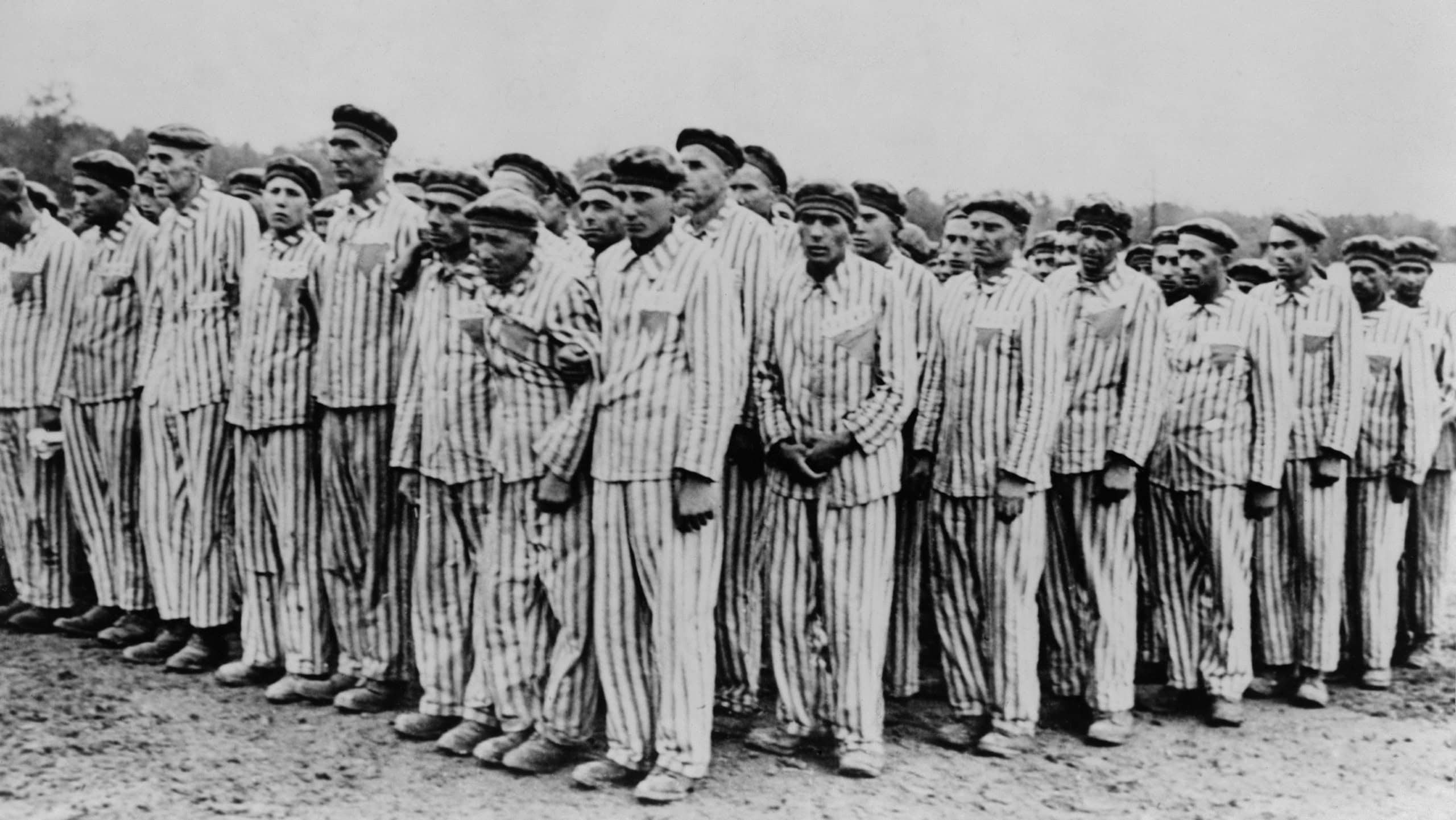 Roll call at Buchenwald concentration camp, ca.1938-1941. Two prisoners in the foreground are supporting a comrade, as fainting was frequently an excuse for the guards to 'liquidate' useless inmates.