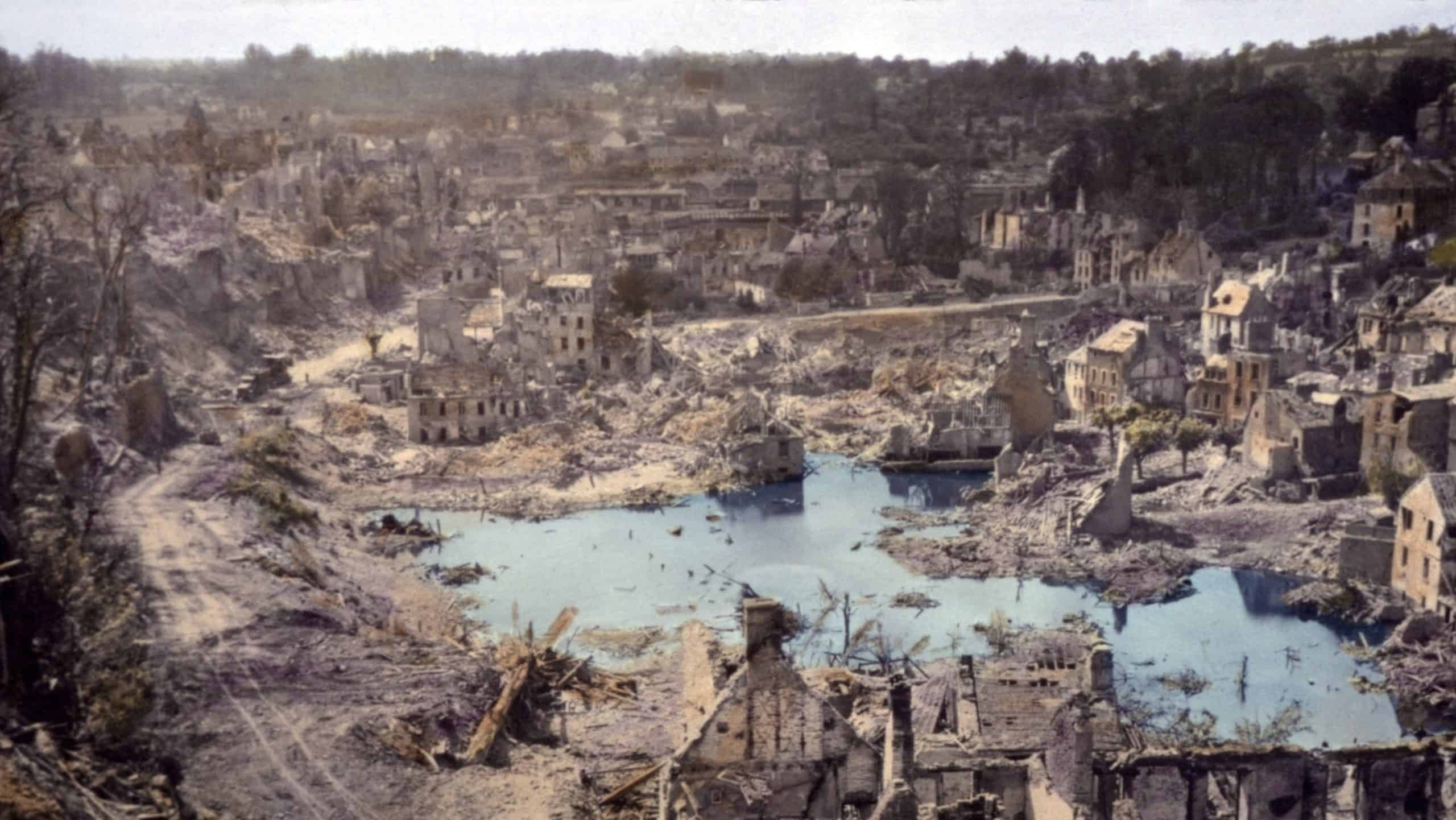 We sure liberated the hell out of this place', remarked a U.S. soldier. Saint Lo, France was 95% destroyed before it was captured from Germans on July 18, 1944. B&W Photo with oil color.