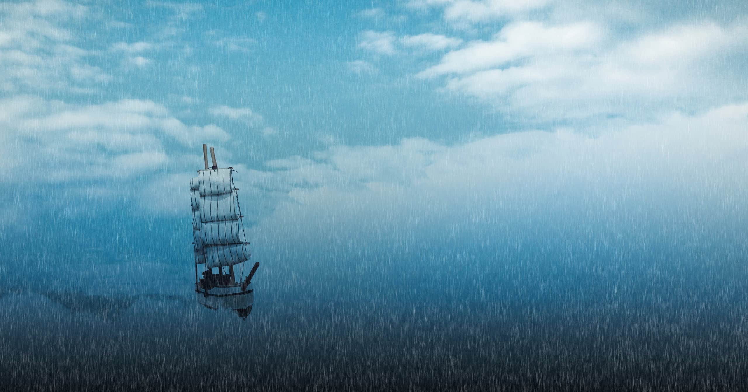 Mysterious ghost sailing ship in the stormy sea at cold night. Pirate ship in the ocean under the foggy and heavy rain.